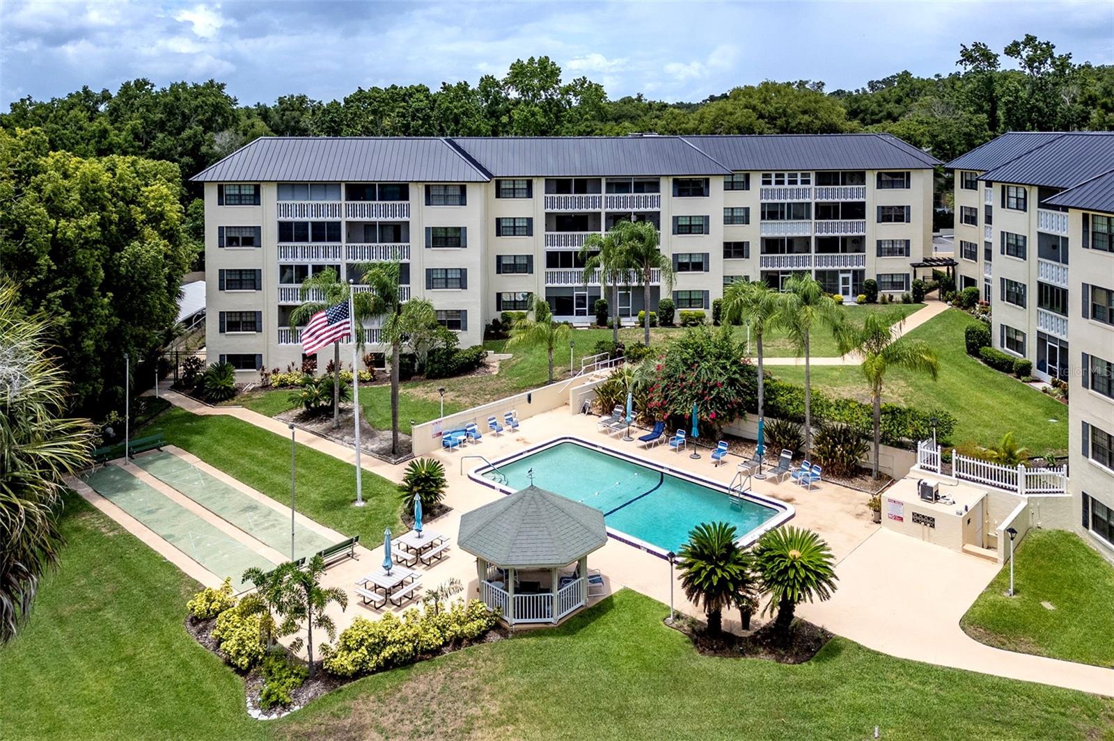 STUNNING MOUNT DORA CONDO FOR RENT!......Experience the charm of downtown living in this beautifully updated 3-bedroom, 2-bathroom condo located in the highly desirable Southern Oaks—a 55+ community nestled in Mount Dora's Historic District. This move-in-ready 3rd-floor condo boasts captivating pool and sunset views, with easy access to the vibrant shops, restaurants, and waterfront just steps away........Key Features You'll Love.......PRIME LOCATION: Walk to the heart of Mount Dora's quaint downtown or enjoy a quick commute via the nearby 429 Expressway to Winter Park, Orlando, and more.......FRESHLY RENOVATED: New luxury vinyl plank flooring in the bedrooms, freshly painted interior, and modern tile flooring throughout the kitchen, living, and dining areas.......GOURMET KITCHEN: Updated with brand new stainless steel appliances, granite countertops, closet pantry, and a pass-through bar to the spacious living and dining rooms.......RELAX IN STYLE: Your own private, tiled, and screened porch with peaceful pool views—perfect for enjoying morning coffee or evening sunsets.......MASTER SUITE RETREAT: Double closets, an updated en-suite bathroom featuring a granite vanity, and a walk-in glass shower for ultimate relaxation.......RESORT-STYLE AMENITIES: Southern Oaks offers everything from a heated pool and shuffleboard courts to a large community workshop, two laundry rooms, elevators, a remodeled rec room with a kitchen and library, and more.......CONVENIENCE AT EVERY TURN: Designated storage space, an assigned covered parking spot, guest parking, and laundry facilities just steps away from your door. Plus, enjoy peace of mind knowing that Southern Oaks has been newly updated in 2024 with refurbished elevators, new roofs, freshly painted carports, and enhanced landscaping and irrigation. Water, sewer, trash, and basic cable are included in your rent, and cats are considered!......Don't miss your chance to live in one of Mount Dora's most sought-after communities—this gem won't last long! Contact us today for a tour. (One or more photos have been virtually staged.)