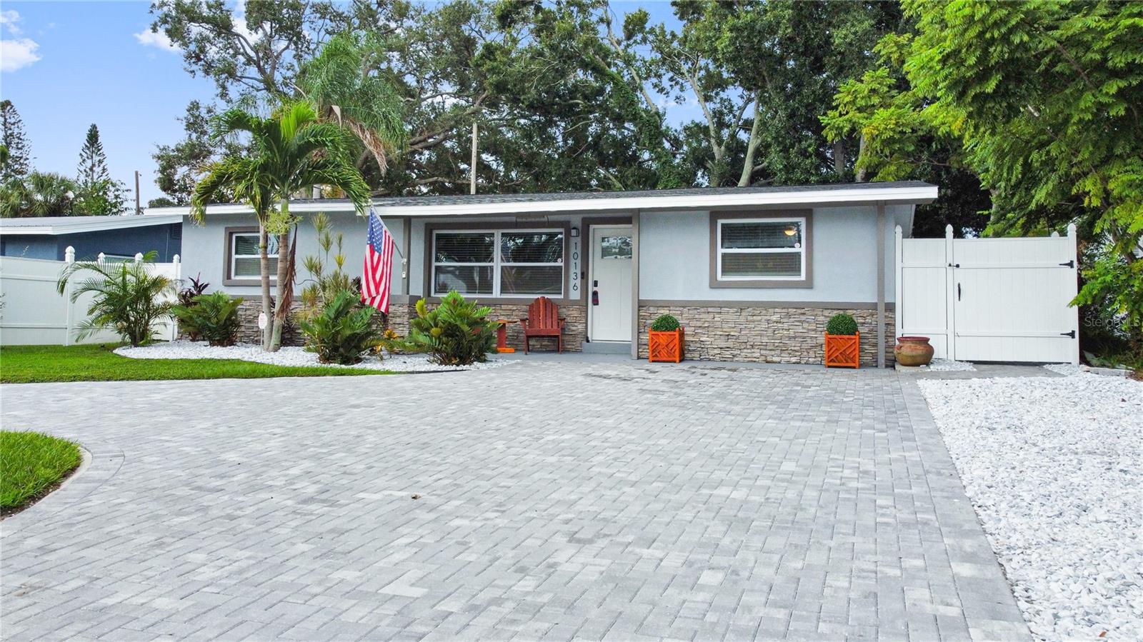 SUPERIOR LOCATION for this four bedroom two bath Seminole home nicely updated and ready for a new owner. The effective age of the home is 2003. Newly created paved circular driveway for plenty of parking. The home boosts of beautiful porcelain tile plank flooring throughout with smooth transitions. new roof 2019, new central AC January 2025, water heater 2023, and two mini splits also added in 2019. Energy efficient Anderson windows in front and side of home and Blair soft water system. Updated ceiling fans, bathrooms and newly installed security system. The bedrooms are split into 3 different areas of the home for privacy, with an outside entrance to the 4th bedroom, which can also be used as an office, work out room or playroom. Large back yard will accommodate a pool, and also has a 10 X 10 shed for storage and a small fire pit for entertaining. Home is walking distance to the Pinellas Trail (47 miles long)Blossom Lake Park and Orange Grove Elementary, which is a highly rated school. Additional schools in the area are Keswick Christian School and Richard O Jacobson Technical High School, and just three miles form Madeira Beach. Easy commute as it's 35 minutes to Tampa Airport and 25 minutes to downtown St Petersburg .Tons of shopping and restaurants within ten minutes, yet nestled back in a cozy quiet neighborhood in a non flood area. This is a must see in a great neighborhood.