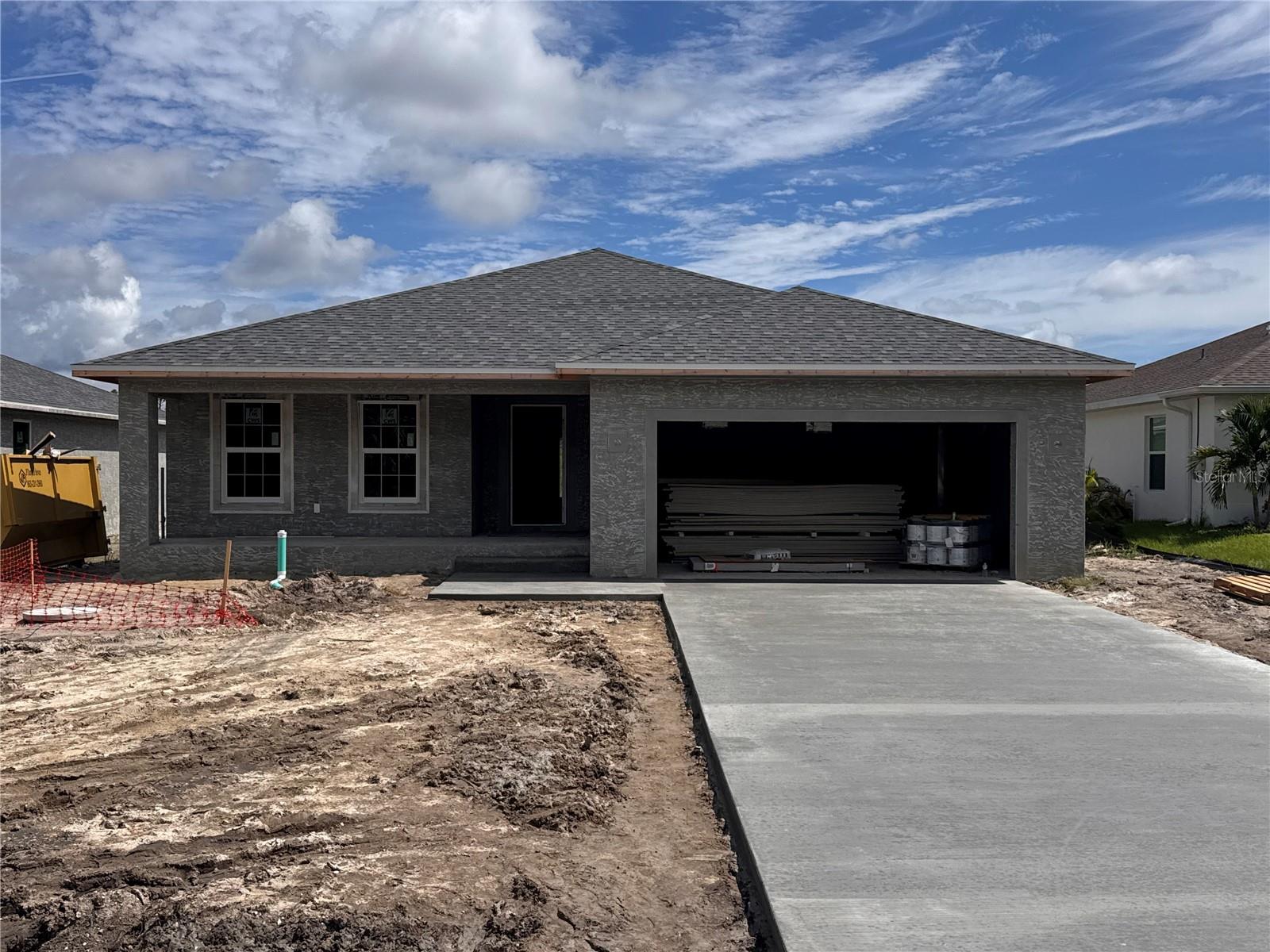 Under Construction. NO FLOOD ZONE....Our Model features an open floor plan from the minute you walk in the door. This home as 1752 sq foot of Living Space, 3 bedrooms, 2 baths and 2 Car Garage with a large Lanai. The open kitchen is perfect for entertaining, includes a spacious island, breakfast/dining area, and French Doors leading to the lanai to enjoy your morning coffee. The master bedroom includes a walk-in closet, Tiled shower, and Dual sink vanity. The 2 Guest bedrooms are located on opposite side of Master making it a split floor plan. Guest bathroom has a tiled shower/tub combo. The living room features cathedral ceilings. The home features plank tile throughout, granite countertops in the kitchen and bathrooms, recessed lighting, ceiling fans in every room, and Stainless Steel Appliances. The home comes with hurricane/storm shutters. COME VIEW THIS BEAUTIFUL HOME or CALL TODAY FOR AN UPDATED LIST OF OUR BUILDS! PLEASE NOTE - the pictures for this listing are a representation of the subject home being constructed. Interior and exterior paint colors, tile color, shingle colors, tray ceilings, fans, lights, manufacturer of appliances, interior/exterior door style, cabinets and landscaping are subject to change. Tax Information is for vacant land