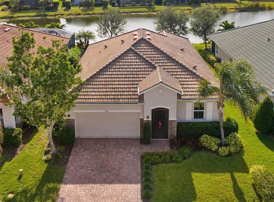 ***MAJOR PRICE IMPROVEMENT!** This Spacious NEWER 2018 BUILT STONEYBROOK WATERFRONT HOME features 4 BED/2 BATH and has been FRESHLY PAINTED! IMMEDIATE OCCUPANCY! It has beautiful exterior stonework and HUGE SEAMLESS LANAI SCREENS to take in the breathtaking panoramic LAKE VIEWS and wildlife. STONEYBROOK offers engaging activities for the whole family, from PICKLE BALL, bingo, water aerobics, yoga morning, plus fun holiday and craft events! ***THIS NEWER 2018 BUILT HOME means less maintenance, and your Home Owner's Insurance can be as low as $1000 A YEAR!  Owners have enjoyed watching osprey and anhinga dive for fish in their backyard lake! The COVERED LANAI is 20 x 10 and there's still room to add a future pool! The open floor plan is great for families or entertaining with a large granite breakfast island and modern tray ceilings. Three bedrooms are positioned together in the front, one with a built in desk (office or craft room ready), while the large master bedroom faces south featuring lake views, tray ceiling, and a luxurious tiled en-suite bathroom with a relaxing soaking tub, separate glass shower, dual granite vanity sinks, deep walk-in closet, plus a separate linen closet. The kitchen boast stainless steel appliances, tall 36-inch upper cabinets, a large pantry, and granite countertops. The guest bathroom features dual granite vanity sinks and another bath with shower combo. STONEYBROOK is one of the areas favorite GATED communities, just minutes from Venice Middle school, located conveniently off of Center Rd, with quick access to I-75 and River Rd taking you to Wellen Park in only minutes. The HOA community offers many amenities at a very LOW COST and LOW CDD fees, featuring family friendly sidewalks /biking trails throughout, a gorgeous community pool & hot tub, kiddie splash pool, baseball field, basketball & tennis courts, in-line skate hockey rink, and a 24-hour state-of-the-art fitness center. Downtown Venice and Venice Beach only 20 minutes away! 

Contact me today to schedule a private showing! https://hub.allanglesrem.com/2049-Mesic-Hammock-Way/idx