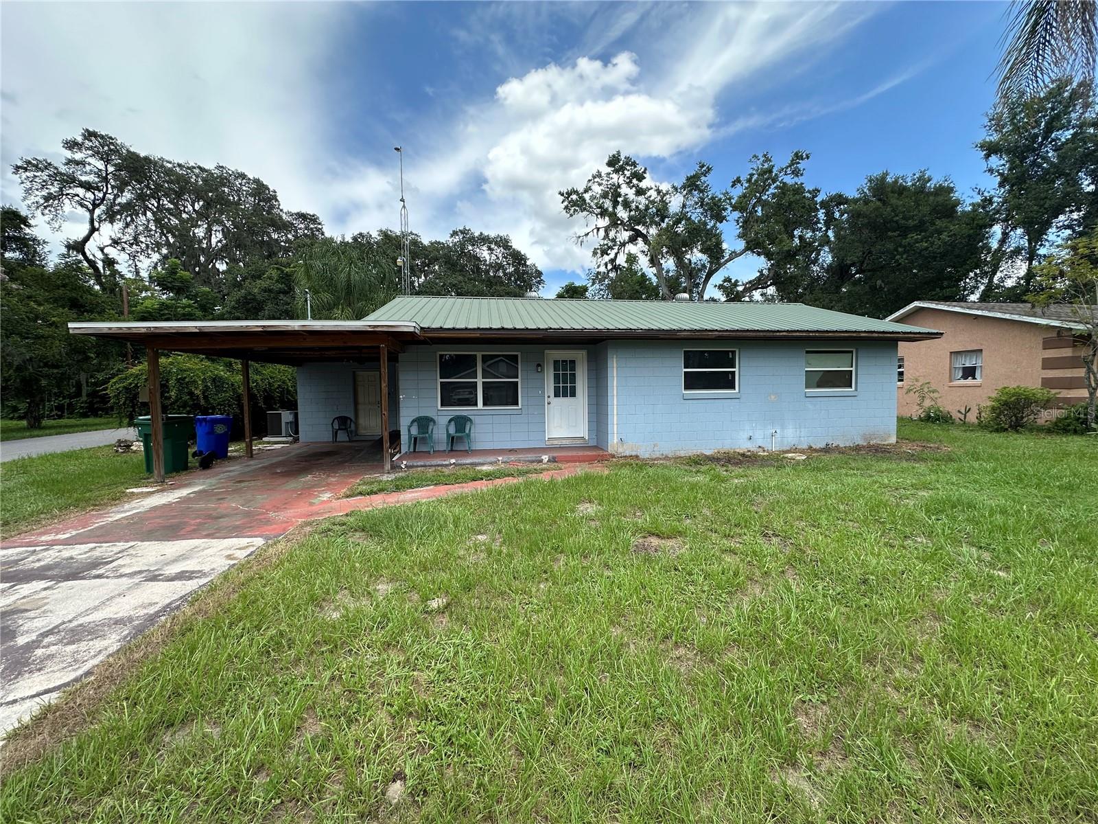 completely renovated 3-bedroom, 2-bathroom home on a large corner lot in wildwood Florida just outside of The Village. Recent updates include new luxury vinyl flooring throughout, completely updated kitchen featuring new appliances, contemporary cabinets, and stunning granite countertops. Peace of mind comes with a durable metal roof and energy-efficient double-pane windows. Beyond its impressive features, this home offers an unbeatable location. You'll be just a short distance from an array of major retailers, including Lowe’s, Home Depot, Outback Steakhouse, First Watch, Five Guys, and Publix. Plus, it's conveniently located just minutes from popular destinations like The Villages Brownwood Square , Pinellas Plaza, local schools, and churches. This home perfectly blends comfort, style, and accessibility.