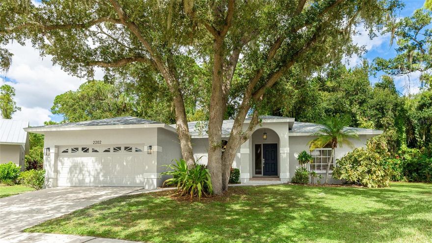 This beautifully renovated home sits on a private, oak-shaded cul-de-sac lot and offers modern living in a serene setting. Inside, you’ll find 100% porcelain plank tile flooring throughout, vaulted ceilings in the living, dining, and foyer areas. The kitchen showcases new white shaker cabinetry, quartz countertops, a 10" undermount stainless steel sink, and a complete GE appliance package including refrigerator, range, dishwasher, and microwave. The primary suite features an en-suite bath with dual sinks and a walk-in shower, while the guest bath includes a tub/shower combo. Additional highlights include a laundry room with sink, shelving, and new LG oversized washer and dryer, plus space for a second refrigerator. Every detail has been refreshed—new roof, exterior paint, doors, blinds, and lighting throughout. The garage is newly painted with an epoxy floor finish and extra storage. Convenient sidewalks and mature oak trees complete the setting creating an ideal combination of comfort, quality, and location.  Just 3 blocks to Colonial Oaks Park with amenities.