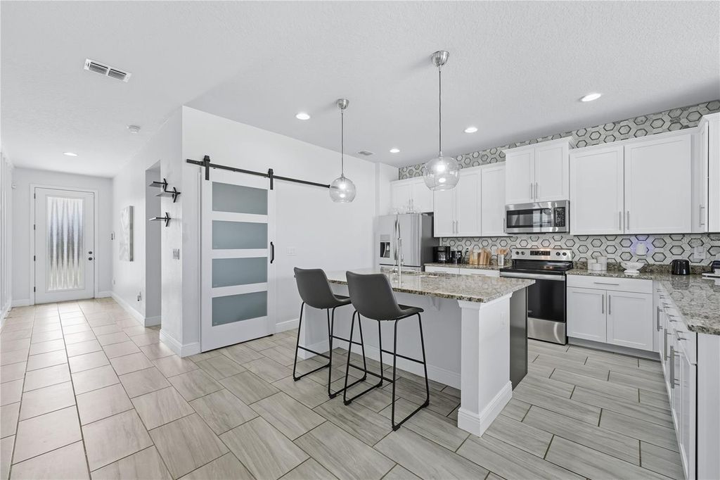 Photo of 133 Whirlaway Drive, Davenport, FL 33837 (MLS # O6377931)