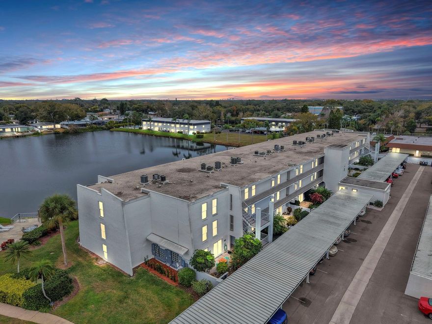One or more photo(s) has been virtually staged. Welcome to low-maintenance Florida living in this beautiful 2-bedroom, 2-bath first-floor condo at 1655 S Highland Ave #J194 in Clearwater, FL. Located in a 55+ community, this home offers a peaceful pond and lake water view and an easy, open layout. Step inside to an open floor plan filled with natural light, enhanced by sliding glass doors spanning both the living and dining areas, creating a seamless indoor-outdoor flow. Both bedrooms feature their own sliding glass doors, offering private access and tranquil views, perfect for enjoying Florida mornings or evening breezes. The private patio is ideal for a relaxing retreat right outside your door. This first-floor unit offers easy accessibility and includes covered, assigned parking just steps away. Whether you’re looking for a full-time residence or a seasonal getaway, this home delivers the ideal blend of comfort and location. Enjoy a short drive to Clearwater’s world-famous Gulf beaches, along with convenient access to shopping, dining, medical facilities, and everyday essentials. Schedule your showing today!