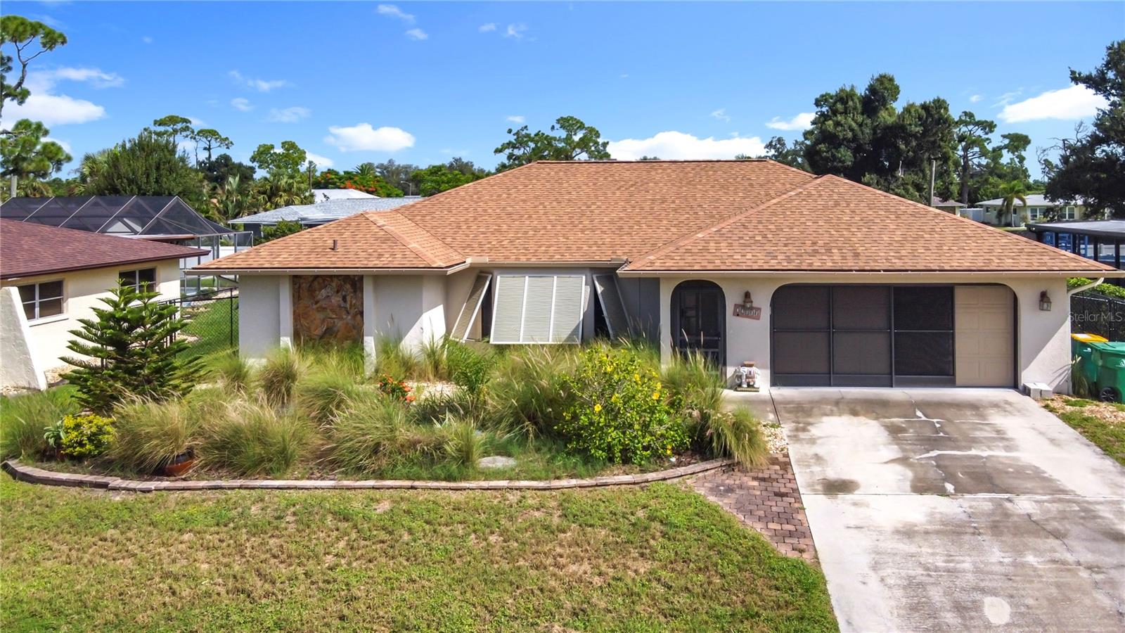 Short Sale. SHORT SALE. Nearly 2,000 sq. ft. of space welcomes you to this 3-bedroom, 2-bath home. From the moment you enter, you’ll notice the thoughtful details The spacious living room is filled with natural light from a large bay window adorned with plantation shutters. The kitchen has been completely remodeled with crisp white and soft gray cabinetry, granite countertops, and abundant drawer storage and counter space—perfect for both everyday living and entertaining. It flows seamlessly into the family room, where a stylish barn door provides privacy for the secondary bedrooms and the updated guest bath. Newer tile flooring enhances the kitchen and baths, while luxury vinyl plank adds warmth to the rest of the home. The primary suite is generously sized and features a stunning en-suite bath with an oversized walk-in shower highlighted by modern finishes and unique design elements. From the primary bedroom, step out to the fully tiled lanai and enjoy your private backyard retreat, complete with a gazebo, hot tub, and storage shed. Important upgrades provide peace of mind, including a new roof (2022). This spacious, move-in-ready home is waiting for you to make it yours!