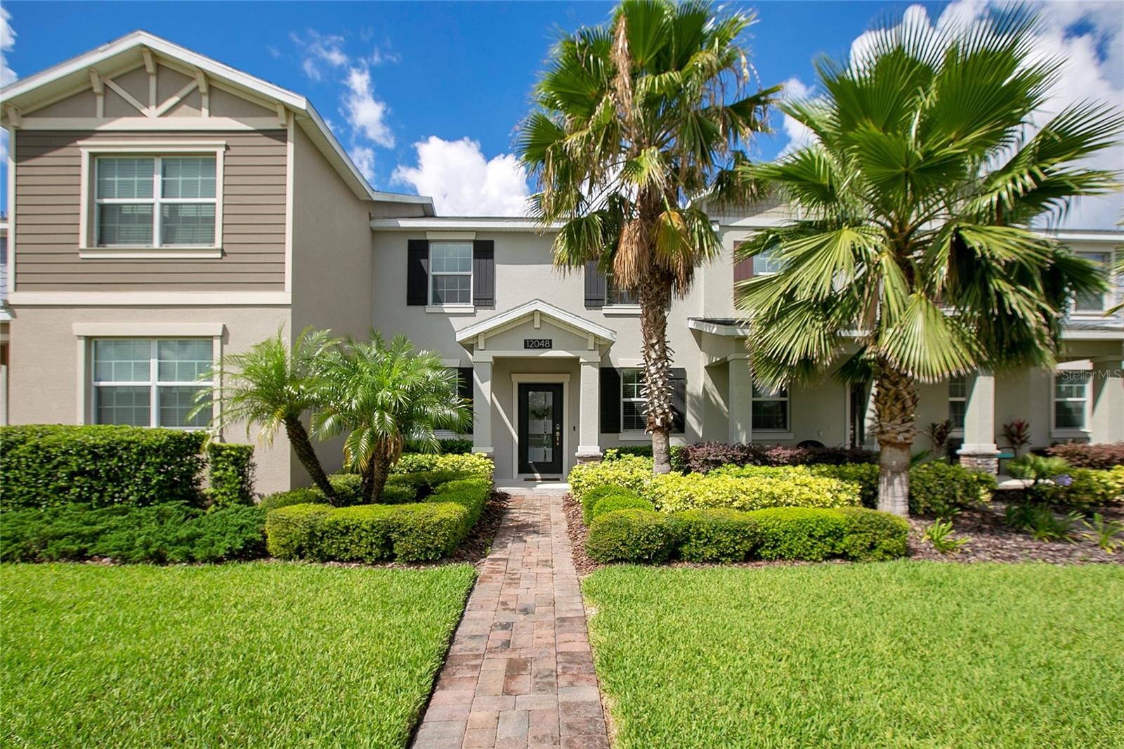 Sonnet is a Wilshire Townhome in Lake Nona’s Storey Park community. This open floor plan, two story, home is complete with 3 bedrooms, 2.5 baths, and stretches 1,615 sqft.
The kitchen features 42” espresso kitchen cabinets topped off with crown molding, stainless steel appliances, gray quartz countertops, island, and breakfast bar that overlooks the living and dining areas. Making this the perfect space to host gatherings and holidays.
Follow the stairs to the second floor and you will find all three bedrooms and the additional two bathrooms in a split floorplan. The additional two bedrooms are complete with their own built in closet. The Master Bedroom features a large walk in closet and the ensuite is complete with an espresso cabinetry double vanity and walk-in shower.
What brings this home together, is the private outdoor patio space located between the home and the 2-car garage. This space includes a covered walkway with space to entertain, host, or enjoy your time to simply relax.
Storey Park’s HOA also includes lawn maintenance, high speed internet, home phone, and 300 channel cable TV. In addition, the amenities in this community include a resort-style pool, 24/7 fitness center, playground, tennis courts, 3 dog parks, nature trails, basketball court, and not to mention conveniently located close to Orlando’s International Airport, Tavistock Restaurants, Boxi Park, and Lake Nona’s Town Center.
Welcome home!