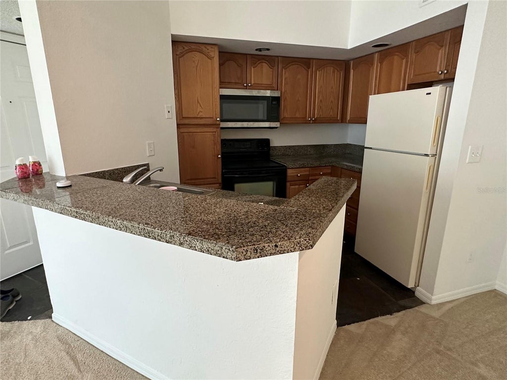 Photo of 4572 Commander Drive #1234, Orlando, FL 32822 (MLS # O6424050)