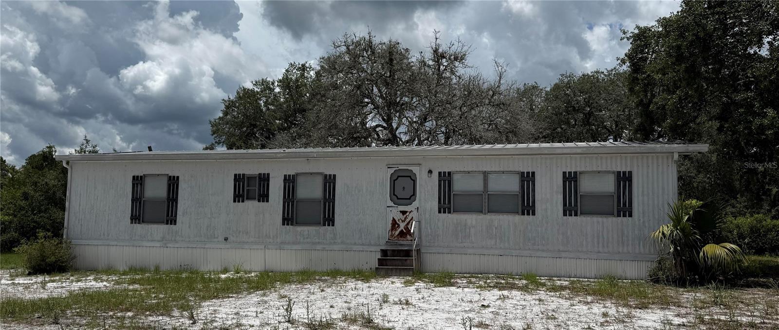 Peaceful Country Living on 5.74 Acres!
Discover the potential of this 1979 double-wide mobile home situated on a quiet and secluded parcel in a
serene, rural setting. The home offers a spacious layout and is in fair condition, perfect for someone looking to
renovate or build new. Please note: electricity is not currently connected to the property, and it will be sold
as-is. With nearly 6 acres of land, the possibilities are endless—ideal for those seeking privacy, space, or a
future homestead. Come enjoy the tranquility and natural beauty of this peaceful retreat.