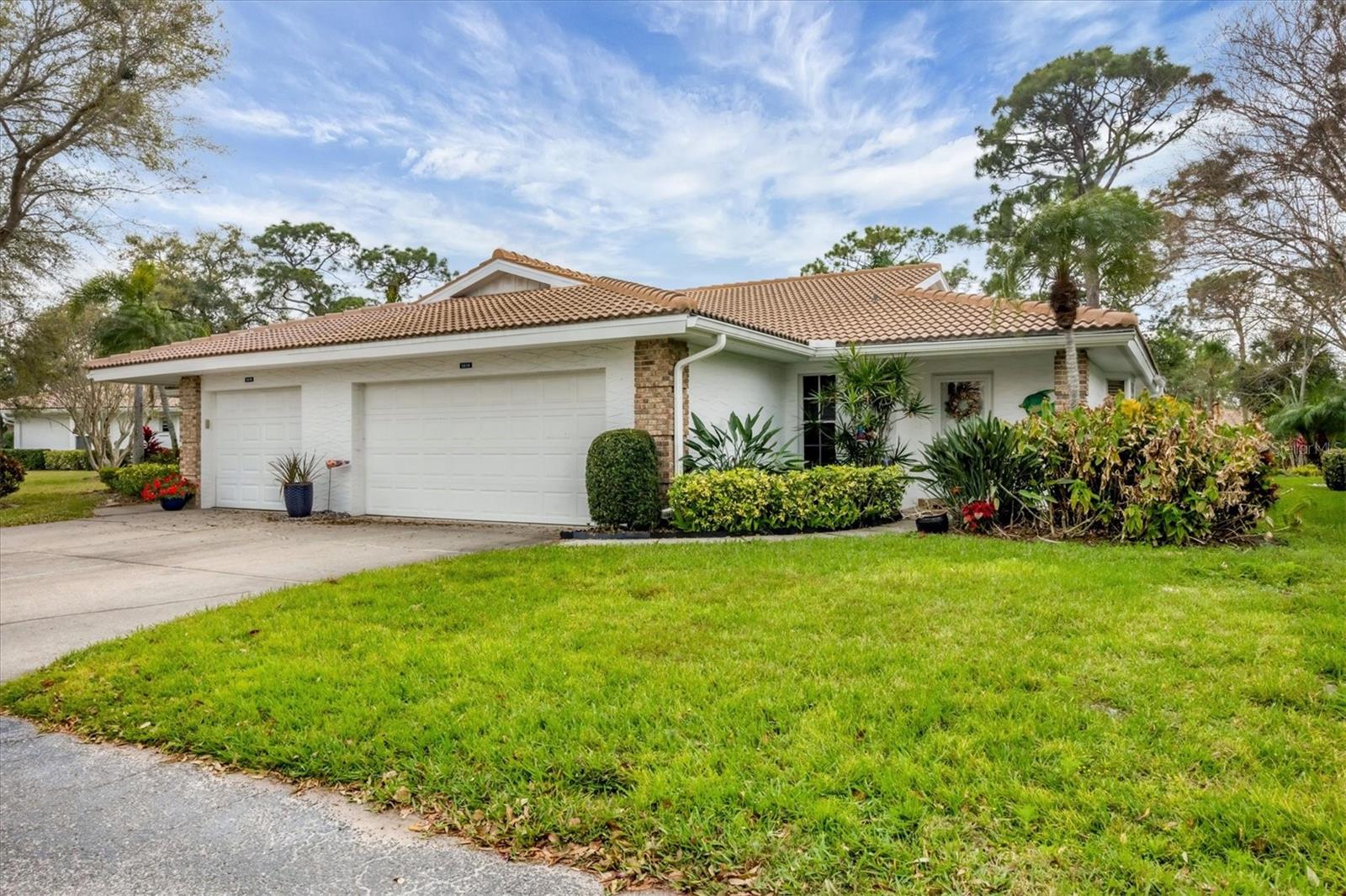 Nestled in a charming 55+ gated community, this beautifully updated villa offers a perfect blend of comfort, convenience, and an active lifestyle. With mature landscaping, scenic walking trails, and a host of amenities, every day feels like a vacation in Garden Lakes.
Step inside to discover an inviting open floor plan with vaulted ceilings and an abundance of natural light. The eat-in kitchen boasts a new sink & faucet, stainless steel appliances, and a convenient breakfast bar—ideal for casual dining or entertaining guests.
This home offers multiple living spaces, including a formal dining area, a living room, and a family room with high ceilings and bright skylight. The screened lanai adds even more flexibility, serving as a quiet retreat for morning coffee or a peaceful space to unwind with a good book.
The owner’s suite is a true sanctuary, featuring a generous walk-in closet, updated vanity with dual sinks, and direct access to the lanai. The home’s private guest suite is complete with its own full bath and pocket door for added privacy, ensuring a comfortable stay for your visitors.
Enjoy maintenance-free living with modest fees covering landscaping/ lawn care, irrigation, exterior painting/ pressure washing, cable TV, internet, trash pickup, security gate, and amenities galore. The vibrant community offers an updated clubhouse with a full kitchen, dance floor, meeting rooms, and a library. You’ll enjoy staying active with a giant heated pool, fitness center, pickleball and tennis courts, shuffleboard, and a lively social calendar bursting with fun events and activities.
Perfectly situated between Bradenton and Sarasota, Garden Lakes provides easy access to excellent shopping, dining, medical facilities, I-75, and the stunning Gulf Coast beaches. Whether you prefer exploring the arts and culture scene, hitting the golf course, or simply enjoying the sunshine, this location has it all.
An assumable VA loan may be available to qualified buyers for part of the purchase price- reduce your monthly payment, and no need to be a veteran.
Don’t miss this opportunity to embrace Florida living at its finest! Schedule your private showing today.