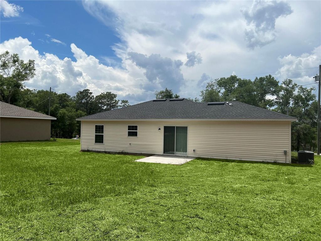 Photo of 185 Malauka Loop, Ocklawaha, FL 32179 (MLS # OM703656)