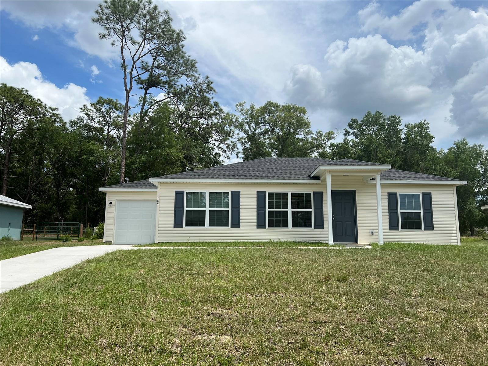 Discover the perfect blend of modern living and peaceful surroundings in this stunning 3-bedroom, 2-bath home. Located in a quiet, well-kept neighborhood in Ocklawaha, this home offers the privacy you crave with no neighbors behind you and a generously sized backyard ready for your personal touch. The open living area flows seamlessly into a modern kitchen—ideal for everyday living and entertaining alike. The primary suite features a walk-in closet and en-suite bath, while the additional bedrooms are perfect for family, guests, or a home office. Whether you’re sipping coffee on the patio or enjoying the peaceful backdrop of nature, this home delivers comfort, style, and a rare sense of seclusion