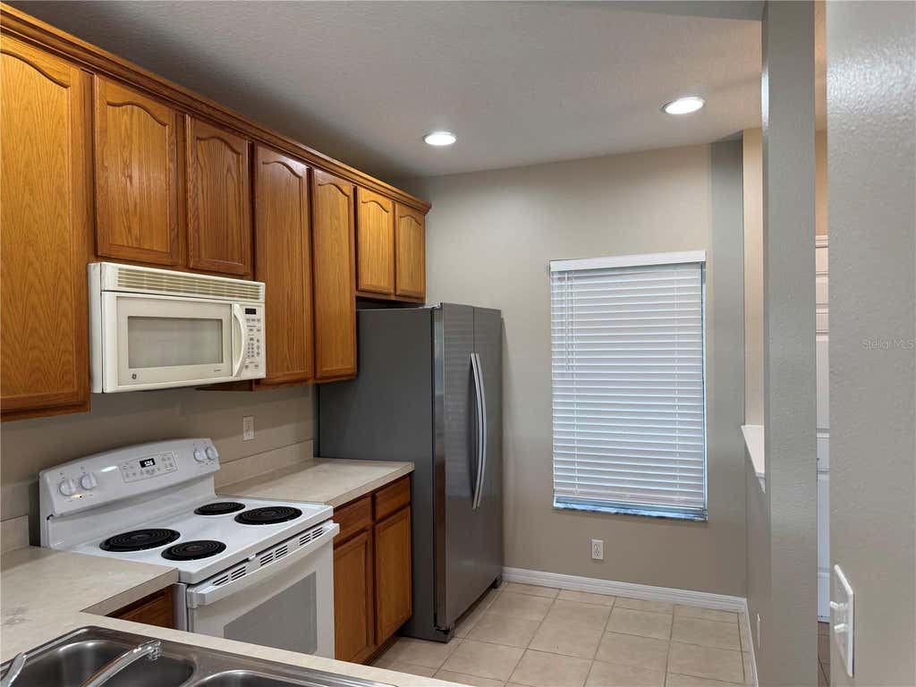 Photo of 9472 Flowering Cottonwood Road #77, Orlando, FL 32832 (MLS # O6432040)