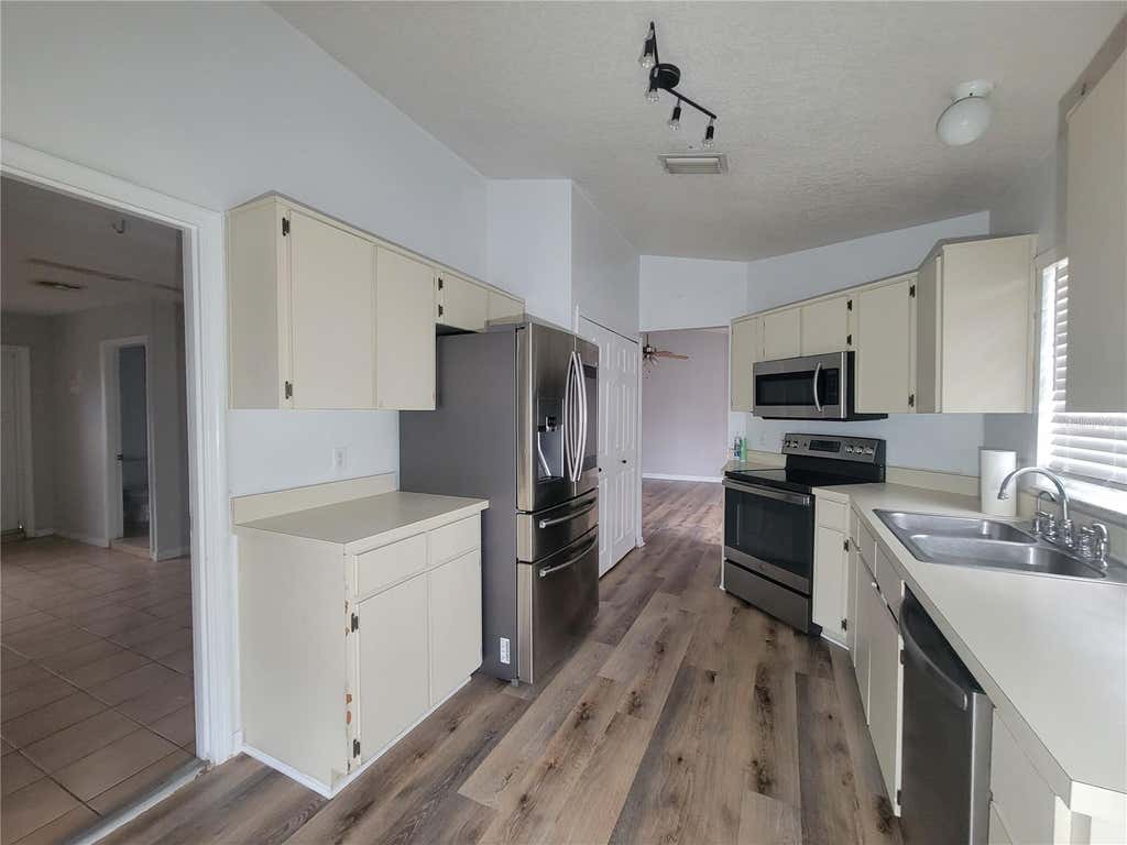 Photo of 9827 Dean Cove Lane, Orlando, FL 32825 (MLS # O6435143)