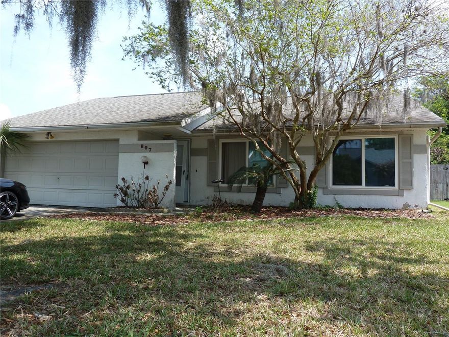Welcome to your next smart move in Oldsmar. This 3-bedroom, 2-bathroom home with a 2-car garage checks the boxes that matter, and leaves room for you to make it your own without paying someone else’s design bill.

Inside, you’ll find a functional split floor plan with the kitchen and living room right where they should be, in the heart of the home. It’s the kind of layout that just makes sense for everyday living, entertaining, or pretending you cook more than you actually do. The screened porch out back offers a solid space to relax, unwind, or enjoy Florida evenings without becoming a mosquito buffet.

Now let’s talk honestly. This home could use a little glow-up. Think cosmetic updates, not a full-blown rescue mission. If you’ve been waiting for a chance to build some sweat equity and add your personal touch, this is it. The bones are there, and the upside is real.

The yard is partially fenced, with some sections needing repair, and the roof, installed in 2002, is ready for your attention as well. It’s a great opportunity to roll improvements into your vision and truly make the home your own from top to bottom.

Important updates you’ll appreciate: the AC was replaced in August 2022, so that’s one big-ticket item already handled. The property sits in a non-flood zone and stayed high and dry through both Hurricane Helene and Hurricane Milton, which says a lot. Located in a deed-restricted community with a low HOA of just $35 a month, you get a little structure without feeling over-managed.

Bottom line, this is a solid starter home with good fundamentals, in a desirable area, priced with its potential in mind. If you’ve got vision and a little ambition, this one could turn into something really special. Come see it today!