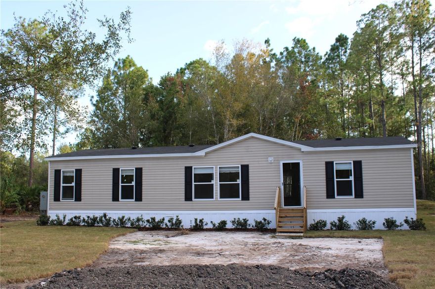 If quiet country living is what you desire look no more, this charming 3 bedroom, 2 bath, home is nestled in the woods and provides plenty of privacy and peaceful living. No HOA's or Zoning restrictions. Plenty of room for your toys, bring your RV, Boat, ATV, and pets. This property is located near Bull Creek Fish Camp which offers a public boat ramp and banks for fishing, also nearby are 2 community parks, country store, hardware and feed store. 20-30 minutes From Flagler Beach, Palm Coast, Shopping, Schools, and Hospital.