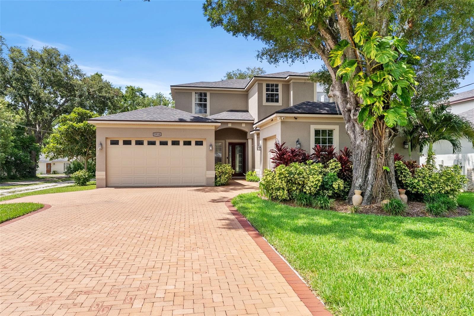 Custom built 4 bedroom, 3 full bath, 2 half bath, 3 car garage home in spectacular Carrollwood area location, so close to all the fabulous dining and shopping options of Dale Mabry. Very comfortable floor plan with nearly 3200 SF of living space that includes first floor owner's suite and home office, open kitchen - family room space, and separate formal dining and living space; 2 first floor half baths. First floor all tile. Excellent layout for entertaining family and friends (indoors and outdoors!). Second floor offers 3 nicely sized bedrooms with two set as Jack and Jill style shared full bathroom. 3rd bedroom and full bath is privately separate. Generous bonus-flex space with wine bar - so many options for this space! Engineered hardwood in main living areas upstairs, as well as stairs. Private fenced outdoor area and beautiful deck is ready for the next BBQ with friends and family, shaded by lovely trees. Lovely curb appeal with wide paver driveway and courtyard style entry.