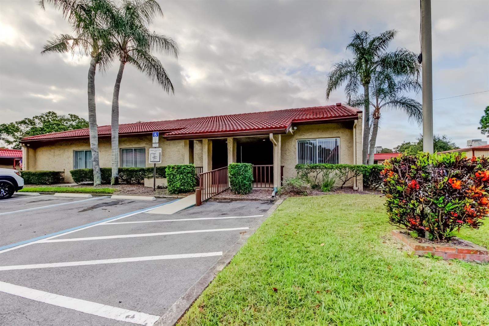 MODERN Light and bright FURNISHED GORGEOUS CORNER UNIT!!!, 2 bedroom, 2 bath won't last long in this desired neighborhood! The spacious and open split floor plan features large room sizes. Both bedrooms have plenty of storage with walk-in closets. The master bedroom includes an en-suite bathroom with an extended vanity and tiled walk-in shower. Whether you decide to utilize the spacious kitchen to whip up a gourmet meal, or sip your coffee in the Florida Room, this home has it all. No details have been missed, newer AC (2016), inside laundry, includes a covered carport and dedicated outdoor storage room. The community is located in a highly desirable area, close to award winning beaches, restaurants, and shopping, including access to Clearwater Beach, Countryside Mall, Downtown Dunedin and Safety Harbor. This well-maintained community showcases a heated pool with sundeck lounging area and club house. The community has recently replaced the roofs and repainted the exterior. Additionally, this unit has prime placement is this community, directly across the street from the pool/clubhouse. HOA fees include water, trash, cable and internet. Not a flood zone, SAVES YOU MONEY $$ !