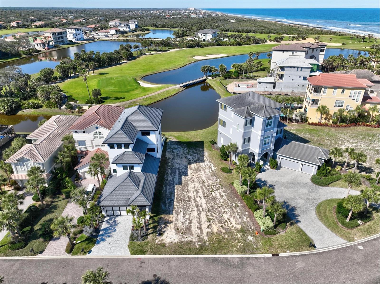 Located in the sought-after Northshore Estates, this prime lakefront and golf course lot offers stunning water views with ocean vistas beyond. Situated in an X flood zone, it carries little to no risk of flooding, providing peace of mind and long-term value. With no build timeline and the option to bring your own builder, you have the freedom to design a custom home to your specifications. Positioned in the desirable, gated community in Hammock Beach, this property provides direct access to coastal living while maintaining privacy and exclusivity. As there are very few homesites available offering lake, golf and ocean views, this is a rare opportunity to secure a premier property in a prime location. Enjoy being steps from the Hammock Beach Club where you can join and have an array of amenities at your fingertips. Many restaurants, multi level pool complex, 2 golf courses, state of the art fitness, full service spa, tennis, pickleball and member social events throughout the month. Seller has available house plans for a 3 story home.