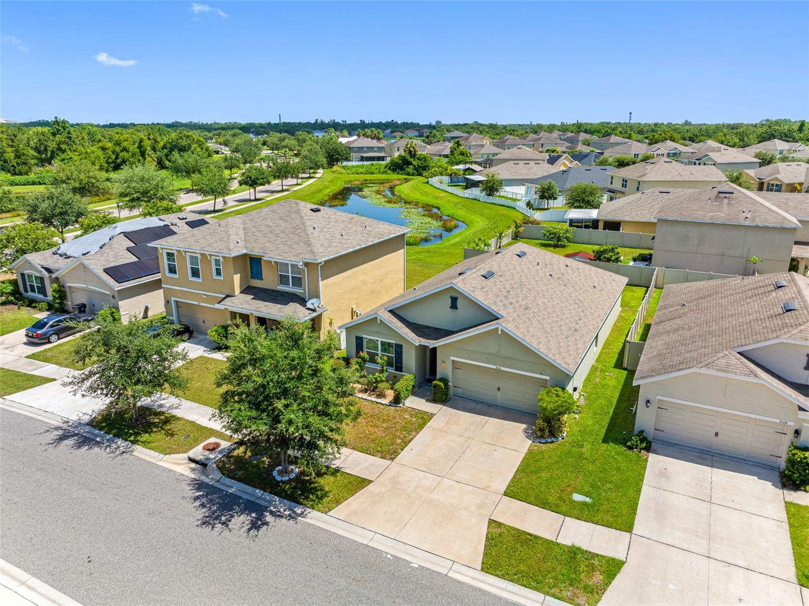 This appealing one-story, 4 bedroom, 2 bath home includes many contemporary features and an open-concept design with 8’8" ceilings. The kitchen includes a large island perfect for bar-style eating or entertaining, a walk-in pantry, and plenty of cabinets and counter space with black appliances. The dining room and living room both overlook the covered lanai with a peak-a-boo water view, which is a great area for relaxing and dining al fresco. The large owner’s suite is located at the back of the home for privacy and can comfortably fit a king size bed and includes an en-suite bathroom with double vanity, huge walk-in closet and separate linen closet. Three other spacious bedrooms share a second bathroom. Laundry is a breeze with a indoor utility room equipped with a washer and dryer, and an extra storage closet outside the 4th bedroom. Plenty of storage in your two-car garage. Enjoy coming home to this lovely community lined with mature oaks, palms and crape myrtles on your drive in. Walk to the community center where you can enjoy a resort-style pool, cabana, playground, basketball courts, tennis court, sidewalks and more! Make an appointment to view this beautiful home today! Please note furnishings have been virtually staged in some photos.