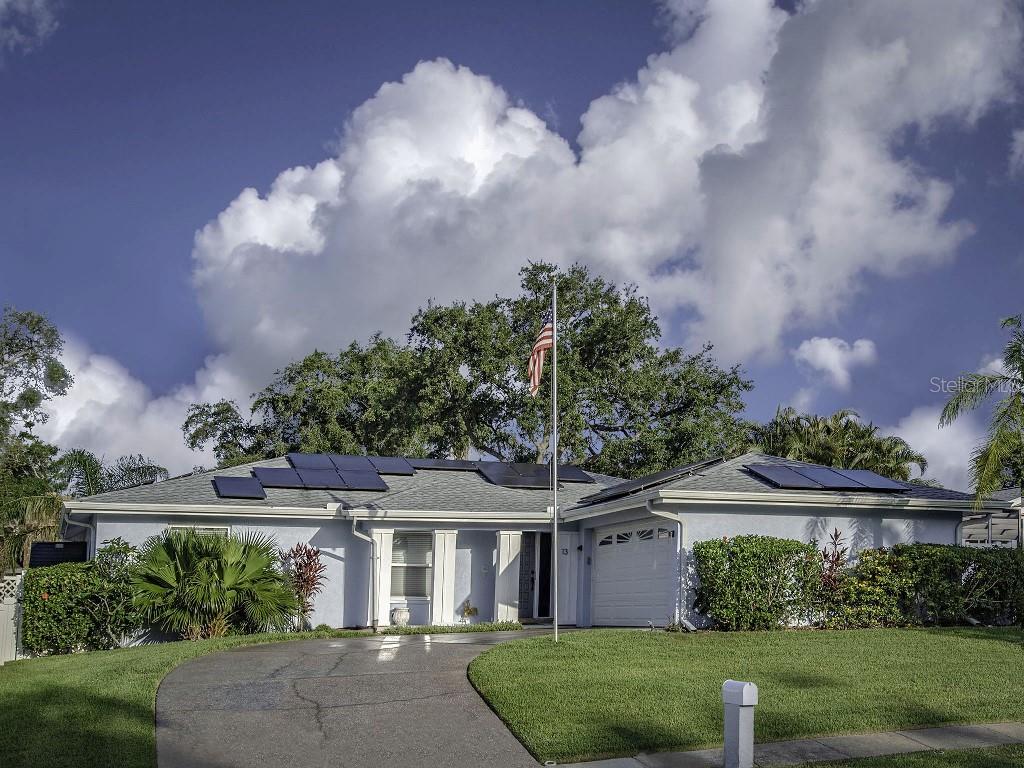 This beautiful 3-bedroom, 2 bathroom, 2-car garage home in charming Safety Harbor is move-in ready! Featuring a remodeled kitchen, remodeled bathrooms, and luxury vinyl plank flooring installed throughout in 2022. The roof, pool heater, pool pump, pool filter and dishwasher—all replaced in 2020-2021, plus new A/C and electric panel upgrade in 2023. With a bright, open layout, this home features a spacious family room and great views of the sparkling, oversized pool from the kitchen and living areas. The screened lanai is perfect for entertaining or just enjoying your morning coffee, and with outdoor fans and a motorized sun screen (installed 2023), you can enjoy sunny Florida outdoor living all day and evening. Thirty-two solar panels, fully paid off, mean no more paying expensive electric bills! Have an electric car? You’ll appreciate the Level 2 EV charger in the garage. NO required HOA fees. Comes with a security pool fence. Nearby downtown Safety Harbor offers a vibrant community with a Farmer’s Market, Third Friday celebrations, and food, art and music festivals throughout the year. Scenic Philippe Park and North City Park are just minutes away. Don’t miss this opportunity to own your own dream home in one of Tampa Bay’s most charming communities.