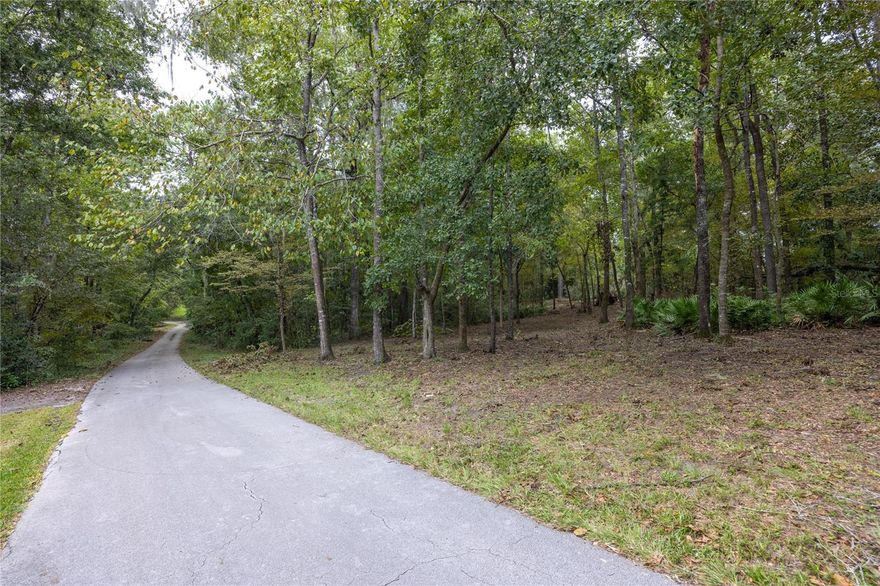 Bring your Architect and dreams to this beautiful 2 acre lot in NW Gainesville's Pelham Place neighborhood. A rare find, a little known hidden gen, Pelham Place provides peace, quiet and security all while being surrounded by homes of distinction and quality. Located next door to Thornebook Village Shopping Center and blocks from Fresh Market, Uppercrust, Dorn's and NW Seafood. Pelham Place is a deed restricted, gated community with a winding tree-lined cul-de-sac street with only 6 lots. This is the last vacant lot. City water and sewer available. Zoned for top rated schools: Littlewood Elementary, Westwood Middle and Buchholz High Schools. Open builder lot. Topographical survey available. HOA $1,000 annually. Just 2 miles to the University of Florida and UF/Health. 15 minutes to downtown Gainesville. Open builder. Topographic survey available.