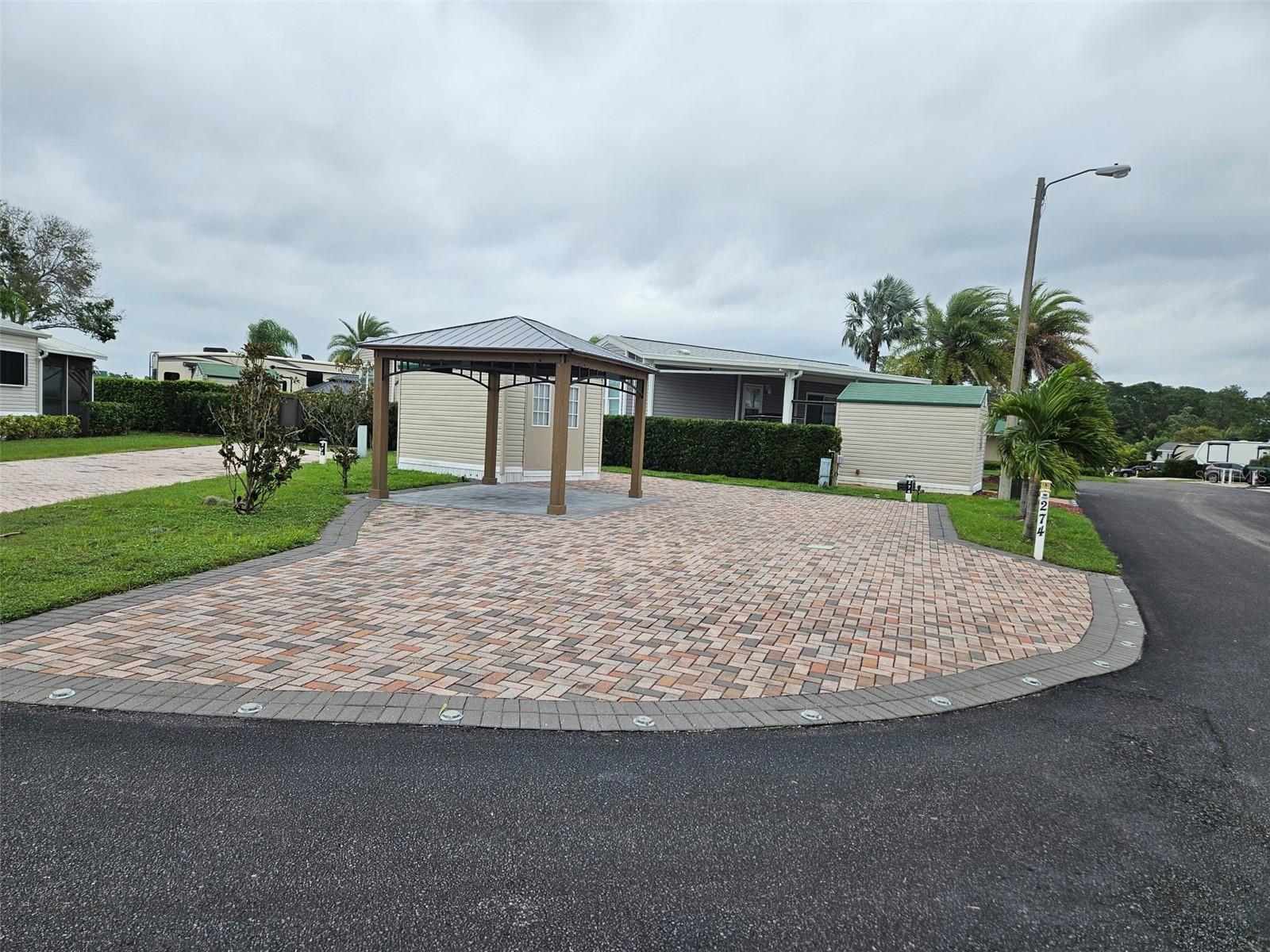 Discover your ideal RV lot at Citrus Valley RV Park, just 25 minutes from the magical experience of Disney World! This spacious and well-appointed RV lot is designed for both relaxation and adventure, making it the perfect retreat for outdoor enthusiasts.
Key Features:
Inviting Atmosphere: The lot boasts a beautifully crafted extra wide paver driveway with nice landscaping, creating an inviting space for gatherings and relaxation.
Comfortable Shed: Enjoy 10'x12' shed with electric.
Outdoor Living: Under the expansive 10'x12' pergola, add your own touch for furniture or BBQ, perfect for entertaining family and friends.
Community Amenities:
The clubhouse and swimming pool are conveniently located nearby, providing easy access to the vibrant community amenities.
Citrus Valley RV Park features additional facilities such as laundry services, showers, shuffleboard courts, and a playground.
This exceptional opportunity to own a piece of paradise near Disney is not to be missed! Whether you're seeking a weekend getaway or a permanent retreat, this RV lot offers everything you need for an enjoyable outdoor lifestyle. Embrace the adventure today at Citrus Valley RV Park!