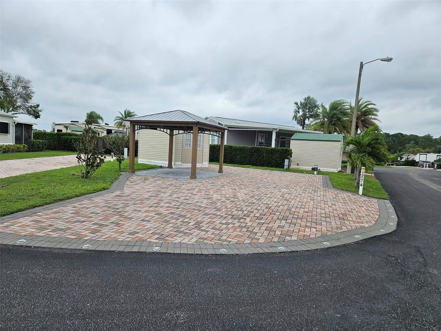 Discover your ideal RV lot at Citrus Valley RV Park, just 25 minutes from the magical experience of Disney World! This spacious and well-appointed RV lot is designed for both relaxation and adventure, making it the perfect retreat for outdoor enthusiasts.
Key Features:
Inviting Atmosphere: The lot boasts a beautifully crafted extra wide paver driveway with nice landscaping, creating an inviting space for gatherings and relaxation.
Comfortable Shed: Enjoy 10'x12' shed with electric.
Outdoor Living: Under the expansive 10'x12' pergola, add your own touch for furniture or BBQ, perfect for entertaining family and friends.
Community Amenities:
The clubhouse and swimming pool are conveniently located nearby, providing easy access to the vibrant community amenities.
Citrus Valley RV Park features additional facilities such as laundry services, showers, shuffleboard courts, and a playground.
This exceptional opportunity to own a piece of paradise near Disney is not to be missed! Whether you're seeking a weekend getaway or a permanent retreat, this RV lot offers everything you need for an enjoyable outdoor lifestyle. Embrace the adventure today at Citrus Valley RV Park!