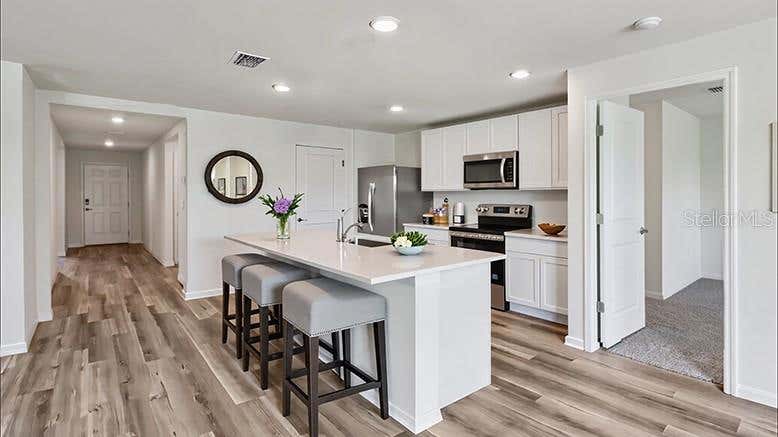 Photo of 8782 Triumph Circle, Wildwood, FL 34785 (MLS # OM731236)
