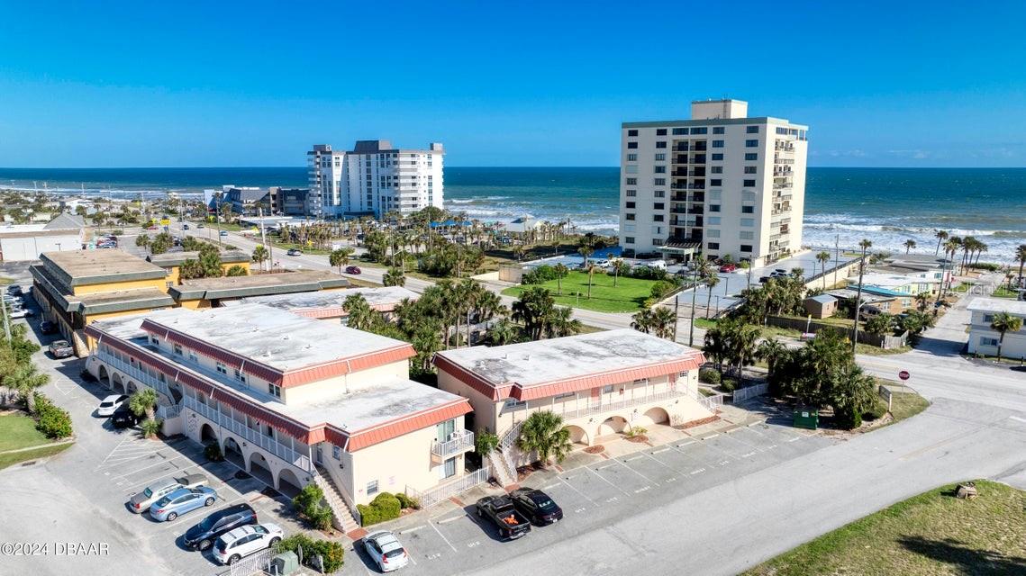 LARGE REDUCTION with a Motivated seller. Perfect BEACH LIVING! Start your day out with a short stroll to Dunkin donuts for your morning coffee. Only steps away from beach access, Tom Renick Park, enjoy gazing at the sunrise, watching the dolphins play and the pelican fly. You are surrounded with everything you could need, famous restaurants for lunch and dinner, Publix and more. Back to enjoy your wonderful 2 bedrooms, 1 bathroom corner unit, remodeled with new flooring, bathroom, kitchen appliances, sink, blinds, eclectic panels, light fixtures, and more. AC 2023, water heater 2024, washer and dryer in unit, 1 assigned parking space and lots of guest parking. All structural, and safety inspections completed '' No structural repairs needed'' No damage or flood from recent hurricanes. Enjoy the ocean breeze and the sound of crashing waves.
