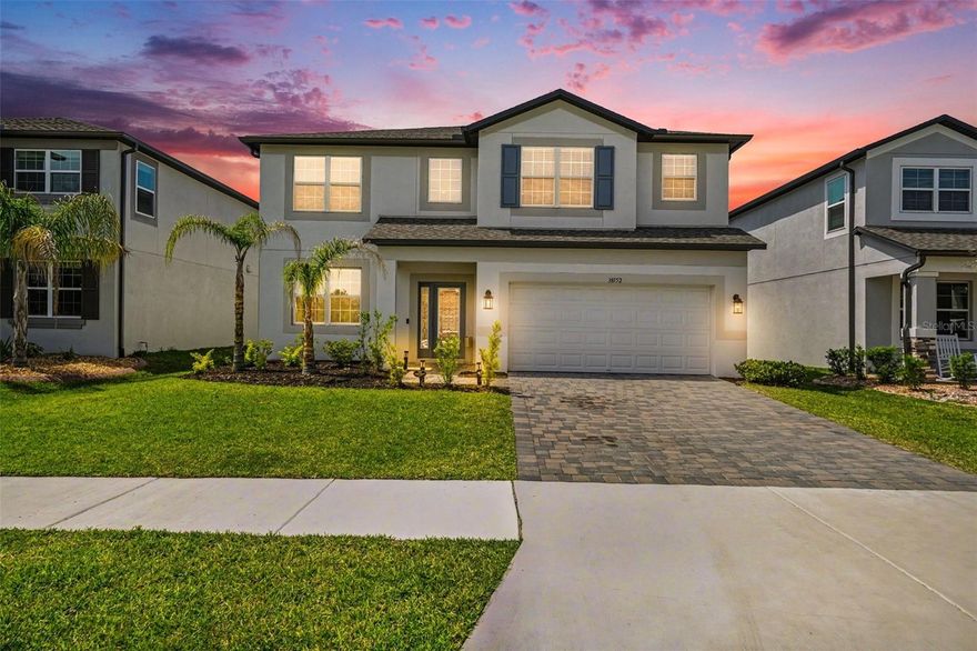 Why wait to build when you can own a like-new home ready for immediate enjoyment? Located in the desirable Cobblestone community in Zephyrhills, this 5-bedroom, 5-bathroom, flex/den space, 2-car garage Mira Lago floor plan by M/I Homes offers a functional layout designed for modern living. This popular Mira Lago floor plan is especially appealing for its layout, featuring a first-floor guest suite with a private bath and a spacious upstairs primary suite, offering a DUAL-SUITE  feel that works well for multigenerational living or long-term guests. The open-concept design connects the living, dining, and kitchen areas, making it ideal for both everyday use and entertaining. The gourmet kitchen features upgraded granite countertops, a large center island, a butler’s pantry, and plenty of cabinet space.  Upstairs, you’ll find a spacious bonus room, 3 bedrooms, along with a well-sized primary suite with a spa-style bathroom and a screened balcony. The home sits on a conservation lot, offering added privacy and peaceful views. With upgrades already in place, this home presents a great alternative to new construction. Conveniently located near shopping, dining, schools, and major roadways for easy access to Tampa and the surrounding areas. Schedule your private showing today.