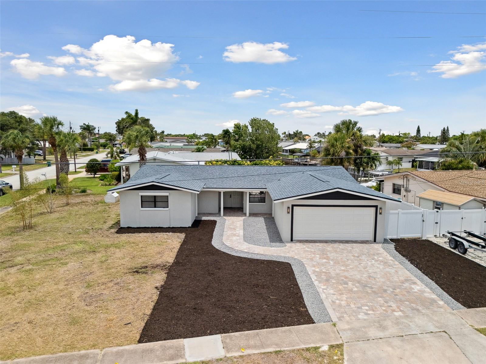 Renovated 3/2 on a spacious corner lot canal front property featuring brand new AC ducts, all PVC sewer lines & PEX water supply lines, hurricane shutters on all windows & sliders, new pavers & a hot tub! Roof and AC units 2017. Hard to find this amount of lot space canal front!