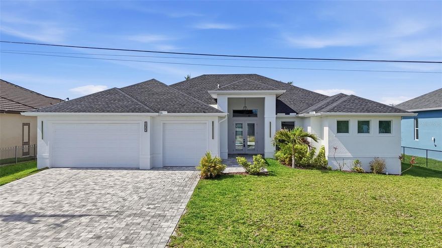 Short Sale. Welcome to your luxury waterfront retreat in the heart of Southwest Cape Coral. Built in 2025, this Gulf access pool home offers 3 bedrooms plus a den, 3 full bathrooms, and over 2,400 square feet of modern living designed for comfort, entertaining, and the Florida lifestyle. Situated on a GULF ACCESS canal, this property is perfect for boating enthusiasts looking to enjoy life on the water.
Inside, you’ll find a bright open layout with soaring coffered ceilings, oversized impact windows and doors, and tile flooring throughout. The chef’s kitchen features a large island, walk-in pantry, custom cabinetry, stainless steel appliances, wine cooler, and an ideal flow into the main living and dining spaces. Pocketing sliders open seamlessly to the expansive covered lanai, creating true indoor outdoor living.
The spacious primary suite offers lanai access, dual walk-in closets, a spa-inspired bathroom with a soaking tub, multiple shower heads, and dual vanities. Guests will appreciate the split-bedroom floorplan, offering privacy and comfort throughout the home.
Step outside to your pool overlooking the canal, surrounded by a large paver lanai with plenty of space to relax or entertain. The concrete dock is ready for your boat, and the oversized 3-car garage provides room for vehicles, toys, and storage. This home has excellent AIRBNB potential as well!
Located in one of Cape Coral’s most desirable waterfront neighborhoods, take your golf cart to Lobster Lady or 239 Prime Steakhouse! Minutes to Cape Harbour, waterfront dining, shopping, entertainment, parks, and some of Southwest Florida’s best boating destinations. Enjoy easy access to Fort Myers, Sanibel, and the Gulf beaches while still being minutes from everyday conveniences.