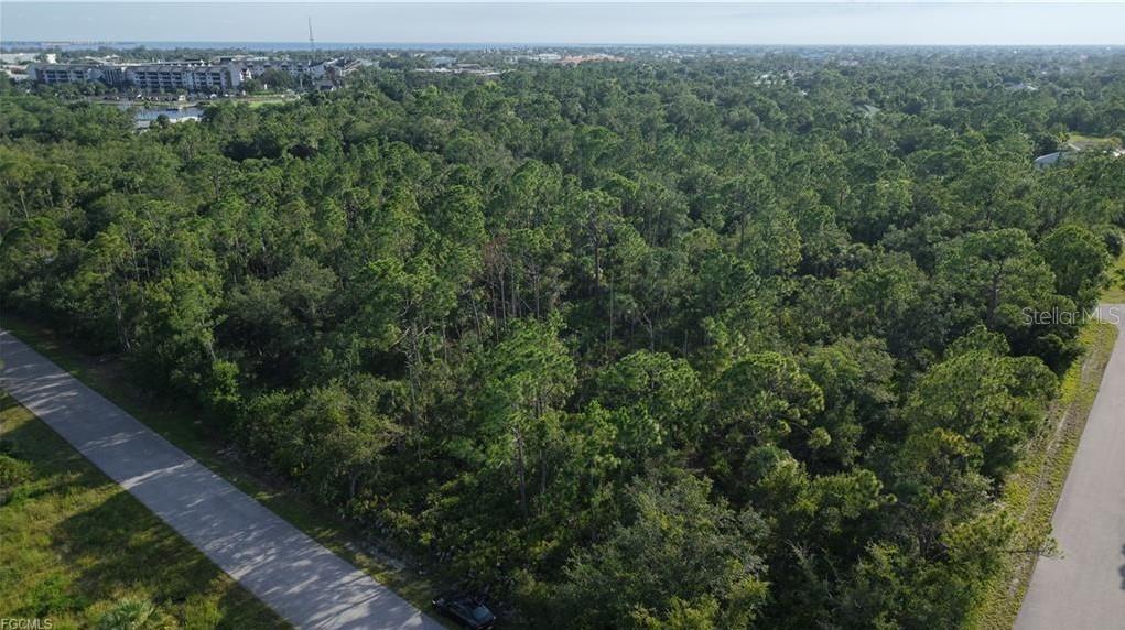 No HOA, deed restrictions or CDDs!!! Not in a zone requiring scrub jay mitigation per the county website 07/25/25 - please reconfirm during due diligence. Don't wait until demand exceeds supply!! This great Residential Single Family Home zoned lot in beautiful Port Charlotte is just waiting for you!! This is nearly a quarter of an acre of the sunny Florida dream. Although out in the scenic Florida landscape, this lot is still conveniently located to shopping, dining, banking, etc. New construction is everywhere you look and you can be part of the action. Information about builders available upon request. Also perfect for self-directed IRA's, 401K's and other investment portfolios. 23.5 MILES TO THE ENGLEWOOD BEACH!