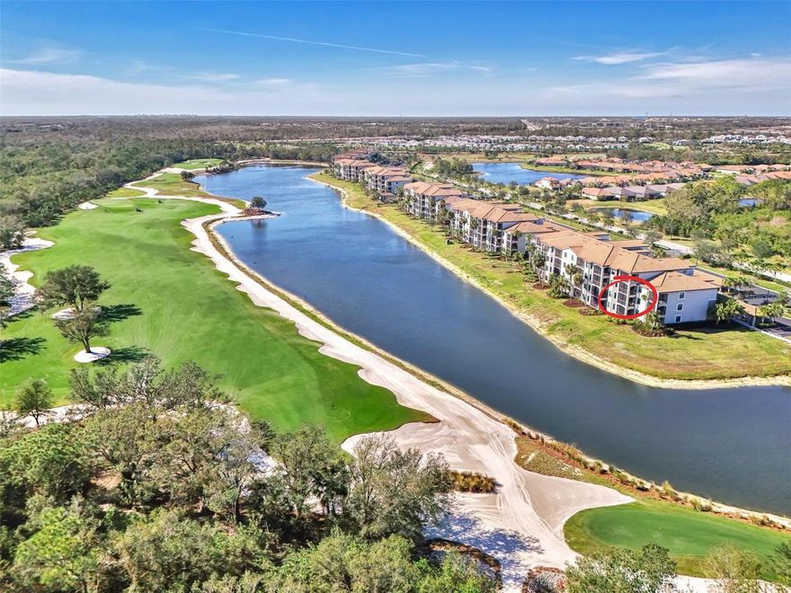 Stunning End Unit with Incredible Views in Lakewood National! Welcome to resort-style living at its finest in Lakewood National Golf & Country Club, located in the heart of Lakewood Ranch, the #1 master-planned community in the country. This beautifully furnished, TURNKEY second-floor end-unit Birkdale model offers exceptional privacy, abundant natural light, and one of the most impressive views in the community.

From the spacious screened lanai, enjoy panoramic vistas of the 11th hole on the Commander Course, peaceful ponds, and protected nature preserves—an ideal setting for morning coffee or unforgettable sunsets. The open-concept layout flows seamlessly from the living area to the gourmet kitchen, featuring a large island, granite countertops, stainless steel appliances, and upgraded custom pull-out pantry drawers.

The split-bedroom design provides comfort and privacy, with a relaxing primary suite featuring a spacious walk-in closet and a beautifully finished bathroom with a walk-in shower. Guests enjoy their own comfortable bedroom with an adjacent full bath. Additional conveniences include in-unit laundry, a private storage unit perfect for bikes or gear, and a covered carport space.

Whether used for full-time living, seasonal enjoyment, or as a strong investment opportunity with 12 rentals allowed per year, this residence offers outstanding flexibility. Lakewood National is a 24/7 guard-gated, maintenance-free community offering an unmatched list of amenities, including two Arnold Palmer–designed championship golf courses, a resort-style pool with waterfalls and lap lanes, a full-service restaurant, poolside tiki bar, state-of-the-art fitness center, full-service spa, tennis, pickleball, bocce, and a vibrant social calendar led by a full-time activities director.

Live where luxury meets lifestyle—this rare end-unit opportunity won’t last. Schedule your showing today!