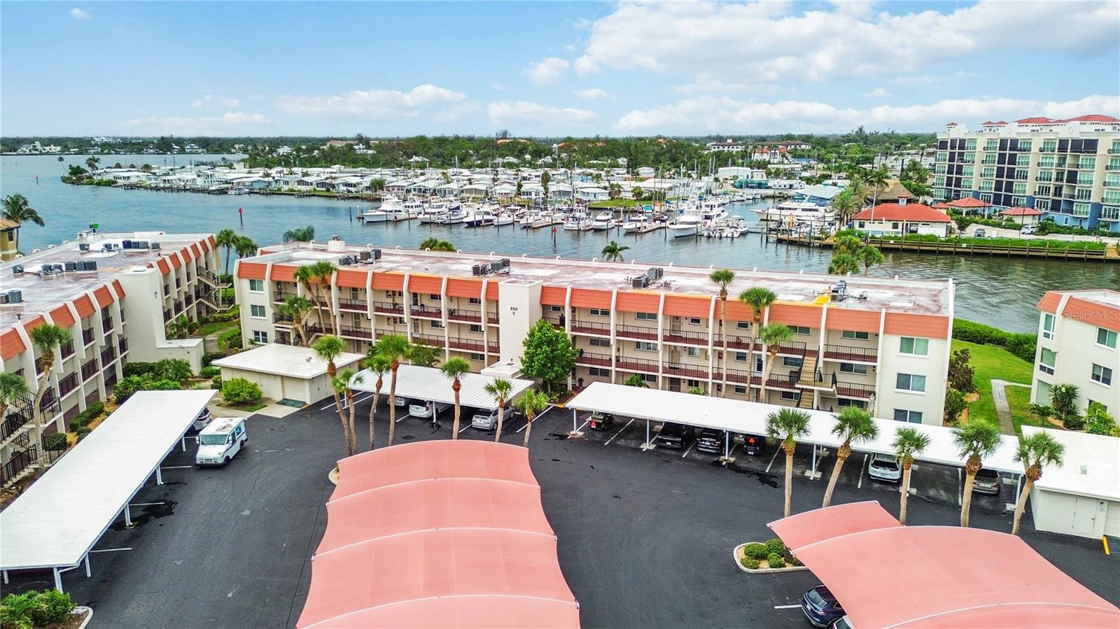 Welcome to your new home right in the heart of Historic Downtown! At Bella Costa, you’re just steps away from everything—amazing restaurants, shops, theaters, parks, festivals, scenic walking and biking trails, and of course, world-class beaches.
This beautifully updated and lovingly maintained unit is move-in ready and sure to impress from the moment you walk through the door. The open layout draws you in with stunning water views that can be enjoyed from nearly every room—including the foyer, kitchen, dining area, living room, primary bedroom, and the sunny Florida room.
Inside, you’ll find two spacious en-suite bedrooms, stylish lighting, impact windows and doors, elegant tile floors throughout, and a fully modernized kitchen and bathrooms. Thoughtful details like plantation shutters, 5-inch baseboards, and two large walk-in closets with built-in storage add extra polish.
The kitchen is a dream for anyone who loves to cook or entertain, with plenty of counter space and a breakfast bar that’s perfect for casual meals or chatting with guests.
Enjoy resort-style living with access to a community clubhouse, fitness center, and a refreshing pool—right outside your door.