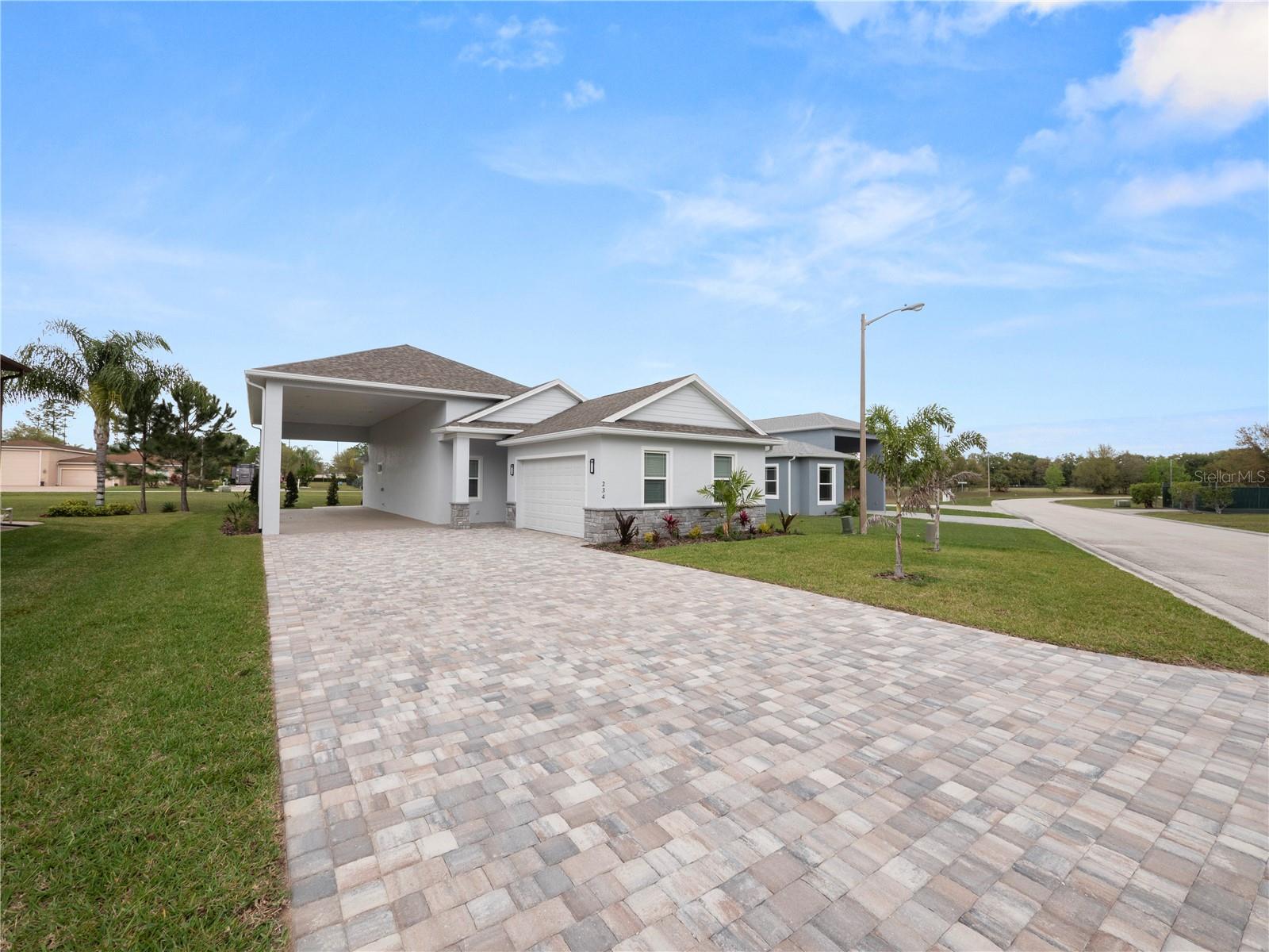This brand new construction home is something to see. Located in the sought after community of Mt. Olive Shores North an RV community. Why wait for a year to build when you can move right in. The home offers 2 bedrooms/2 bathrooms plus an office/flex room. An open living room and kitchen area compliment the sleek look. The primary bedroom has a beautiful walk in shower and double sinks. The closet will have custom cabinets installed before occupancy. The RV port measures 16X55 which is perfect for any size motorhome. Plenty of seating in the front and back of the house for those relaxing evenings. The community boasts two clubhouses with pools and many amenities throughout the year. Call for an appointment to see this beautiful home.