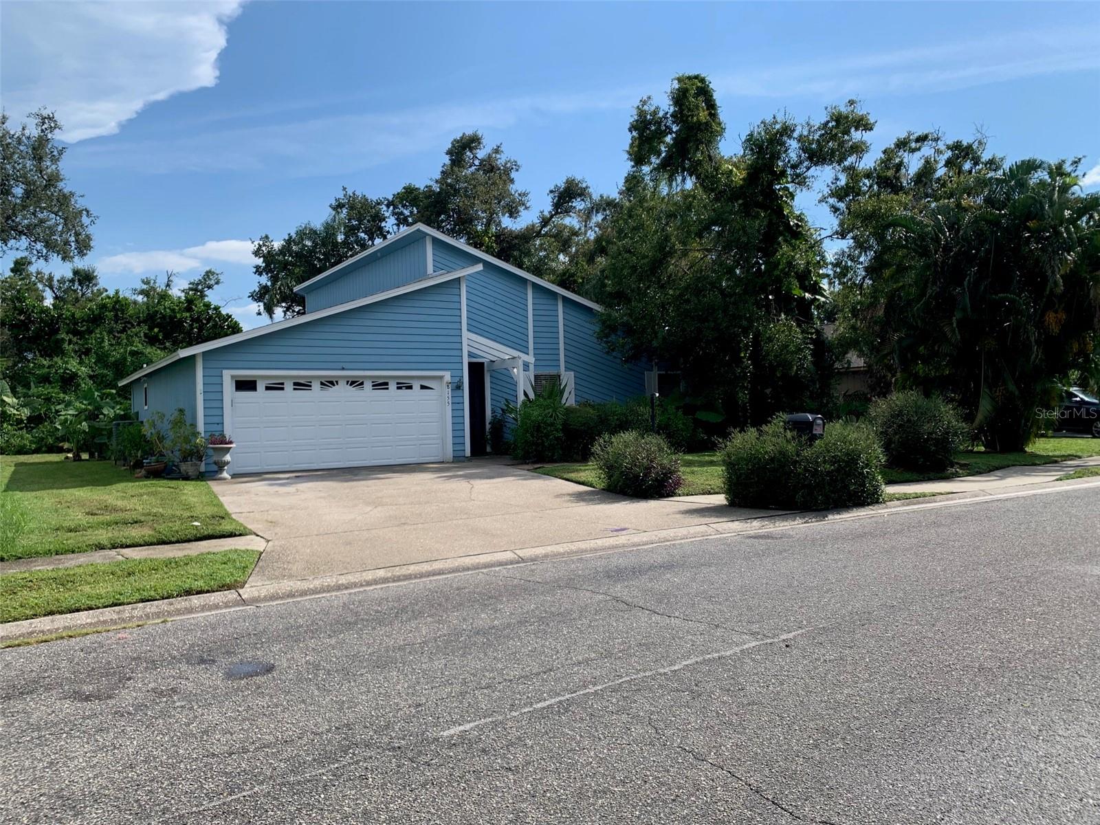 Ready to “Do It Your Way”? This modern style 3Br/2Ba house with vaulted ceilings and new (2025) roof may be your best opportunity! The location, near University Pkwy, with easy access to UTC, USF, Sarasota-Bradenton International Airport, New College, Ringling Museum, Lakewood Ranch, and 101 businesses and shops is ideal! Situated in a quiet neighborhood on a low-traffic culdesac, this split-floorplan 3 bedroom/2 bath house includes a screened front porch that leads into a spacious foyer. There is a 12’ x 38’ screened rear lanai, a wet bar entertainment alcove, and a wood burning fireplace surrounded by warm stone. You’ll appreciate the 2 walk-in closets in the primary suite. There’s an extra storage closet in the 2 car garage, where the newer A/C air handler is. The yard is mostly fenced, including a small area for your dog. Tropical plants will please the Green Thumb. Bring your paintbrush and tool kit – the artistic owner had lots of art decorating the walls! One bedroom was used as an art studio and has a cement floor. The only carpet is in the closets. Houses this size or smaller in the neighborhood have sold for up to $463,000 (up to $539,000 with a pool) in the past year, so your “sweat equity” will pay dividends. This house is ready for a new owner – it could be YOU!