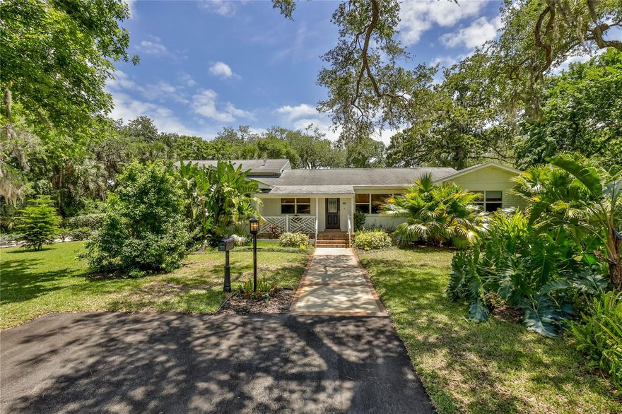 Florida charm at it best. This lovely 3 bedroom 2 bath home located on a beautifully landscaped double lot was majorly renovated in 2009. It features over-sized rooms and exudes Southern Charm.  The gourmet kitchen features high-end appliances including gas stove, microwave, wine cooler, ice maker, and a new Paykel refrigerator.  The casual dining area is adjacent to kitchen with many  more built-in cabinets and antique built-in doors.  This separates it from the large living room and creates a nice flow for entertaining.  The large living room is perfect for relaxing or hosting and flows into the formal dining room.  Just a few steps up you will find the huge master bedroom suite featuring 3 closets (including a walk-in closet) and an additional closet for storage.  On the other side of the living room are 2 large guest rooms and another lovely full bathroom. Back downstairs is a double car garage with Abem powder coated tiles and an on-demand gas water heater.  Double garage contains a Noritz on-demand gas water heater and lots off storage.  The home is surrounded by beautiful flowering plants, fruit bearing gardens and majestic oak trees.  The back deck is accessible from the kitchen and a great place for Alfresco dining.  There are two storage locker closets on the deck to store outdoor furniture and tools.  Plus there is a new 10 x 20 storage shed for all those outdoor toys or equipment.
All measurements are approximates and should be verified by interested persons. ;Water: City