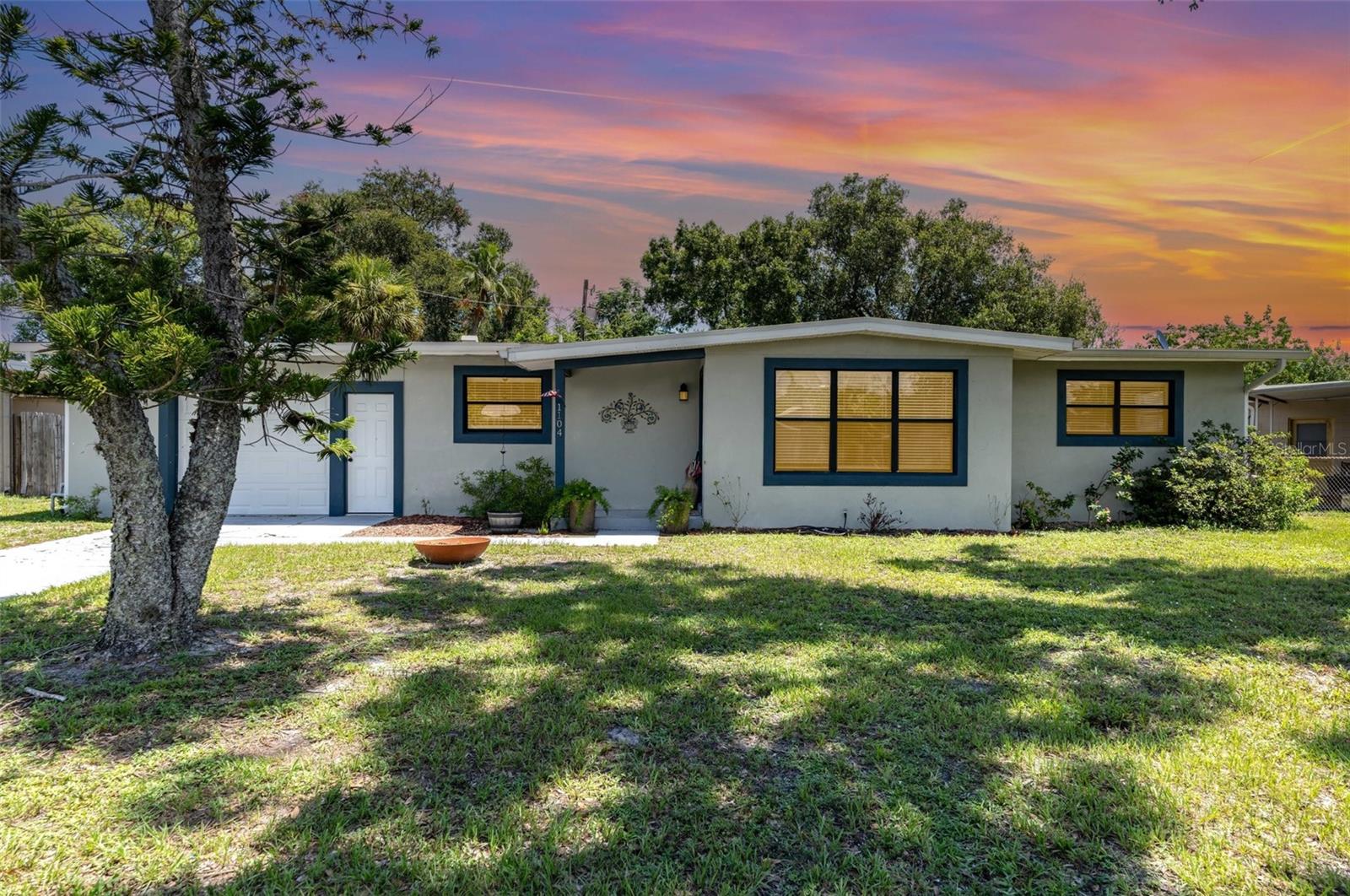 Beautifully remodeled 3-bedroom, 2-bath split floor plan home designed for both comfort and entertaining. The stunning kitchen features granite countertops, stainless steel appliances, a stylish range hood, and a large island breakfast bar with storage. A formal dining room opens through French doors to a new screened-in back porch—perfect for relaxing or hosting guests. The spacious primary suite offers his-and-hers closets, a built-in work station, and new sliding doors to the porch. A barn door leads to the spa-like primary bath with a double vanity and decorative tile shower. Two additional bedrooms share a tastefully updated second bath. Throughout the home, you’ll find abundant natural light, luxury vinyl flooring, and designer light fixtures. Major updates include: roof, plumbing, electrical, HVAC, and gutters. Finally, enjoy gatherings in the roomy backyard—perfect for grilling, games, and there's even enough space for a future pool.