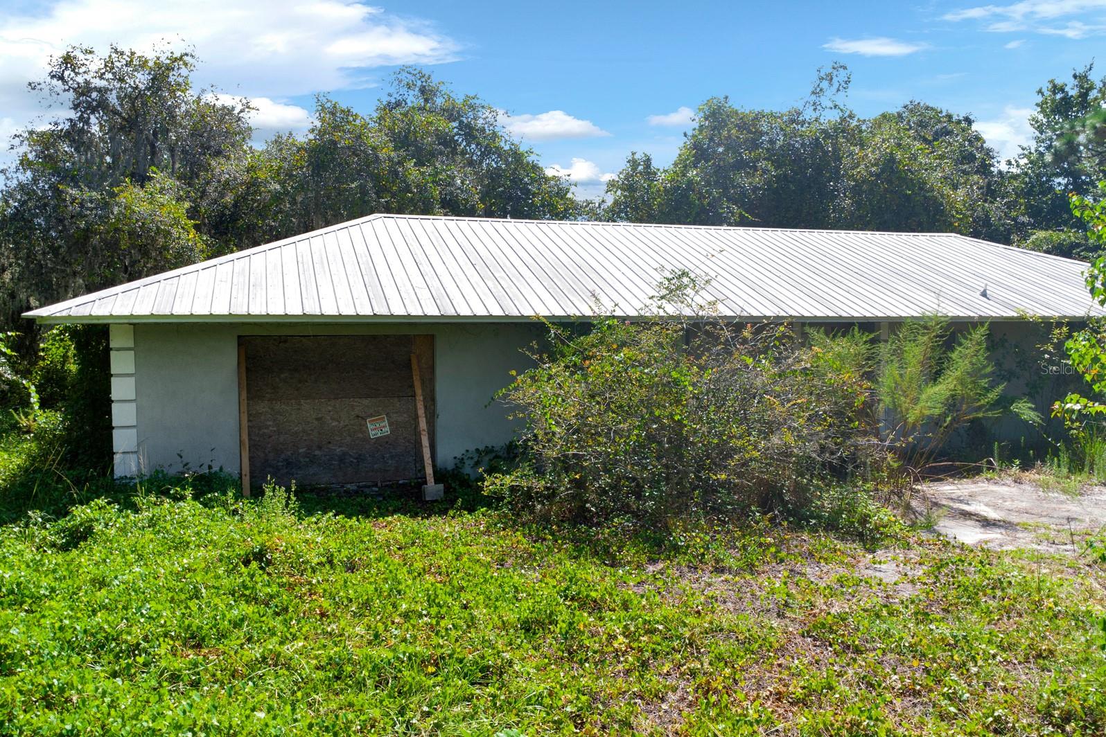 Discover the endless possibilities of this sprawling 5.84-acre property, perfectly situated near the booming Lake Nona Medical City and Orlando International Airport. Enjoy the freedom of no HOA restrictions, allowing you to shape this space to your vision. Although it needs a full renovation, this property offers a blank canvas for renovation, expansion, or development. Seize this unique opportunity—schedule your visit today before it’s gone!