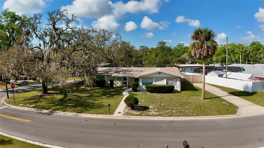 Welcome to 2208 Community Way, a timeless Sanford property full of charm, space, and character. Built in 1959, this well-maintained 3-bedroom, 3-bath home stands the test of time with solid construction and a welcoming feel. Situated on a spacious corner lot, the property is surrounded by beautiful mature trees that provide shade and a peaceful setting. The fully fenced yard offers plenty of room for outdoor living, pets, gardening, or entertaining. The property also features a 3-car carport along with a dedicated RV pad with hookup, offering excellent parking and storage options. A newer roof and AC provide added peace of mind. With its generous lot, unique features, tons of storage, and classic character, this Sanford home offers a rare opportunity to enjoy space, privacy, and convenience in an established neighborhood.