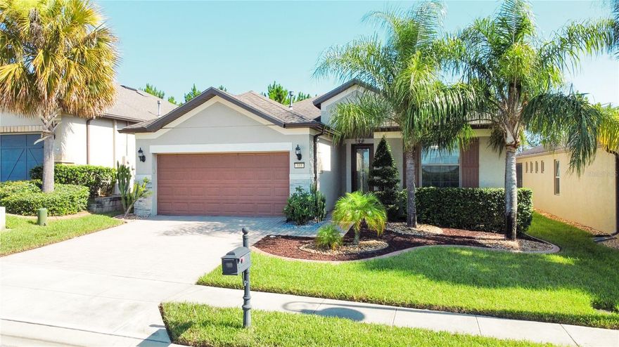 Located in the desired 55+ RESORT STYLE of Del Webb Orlando. the 55+ gated community of. This is a 3-bedroom, 2-bathroom plus a den. The home features an open floor plan and has no rear neighbors. The kitchen features stainless appliances, designer cabinets with lower cabinet pull-outs, a gas range, and a beautiful granite island perfect for entertaining. The gathering room opens up to the covered lanai through large pocket sliding doors to an extended screened and paved oversized entertaining area. The dining room also features sliding doors that open to the lanai. The gathering room and dining room windows in the rear of the home have automatic shades for ultimate convenience and privacy. The master suite is in the rear of the home and features a private retreat with a large walk-in shower, double sinks, and a large walk-in closet. The additional bedrooms and den are located at the front of the home, offering a split plan so everyone has their own space. The laundry room has lots of cabinets for extra storage and a utility sink. Included is a whole-house water filtration system and a portable generator with a professionally installed breaker box transfer switch. In the garage is an enclosed staircase that takes you to an attic great for storing all those holiday decorations and extra ventilation with an installed solar fan. Del Webb Orlando is a gorgeous community featuring a 30,000+ square foot amenity center with indoor and outdoor pools, indoor and outdoor spas, arts and crafts room, a ballroom, an indoor walking track, billiards and ping pong, a fitness center, a tavern, a library with computers, tennis courts, pickleball courts, a basketball court, bocce ball courts, and a dog park. The $425 semi-annual HOA fee provides a 24x7 staffed security gate and master association-owned private road maintenance. Adjacent to the recently renovated 18-hole Heron Golf Club.