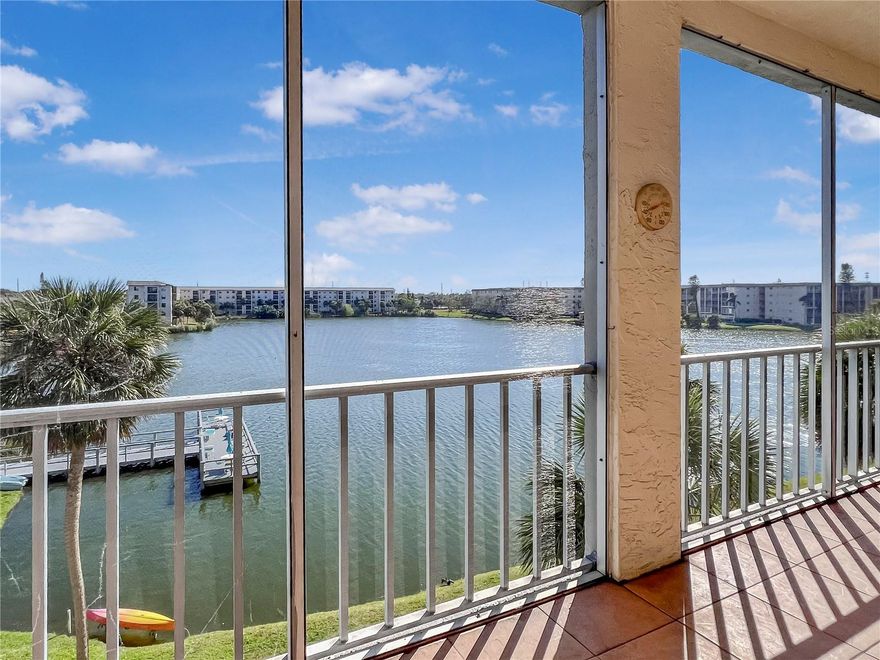 One or more photo(s) has been virtually staged. BEAUTIFUL WATER VIEWS! 4TH FLOOR UNIT! FULLY FURNISHED! LOWEST HOA FEES IN THIS BUILDING + BEST LOCATION IN THE COMMUNITY! Welcome to Bayshore On The Lake, a well established 55+ community just a few miles from our renowned Gulf beaches. One of the best buildings in this community... well managed and well located. This spacious, bright, and open condo offers 2 bedrooms and 2 bathrooms with the option to include the furniture for a seamless move-in process. Gently used for only a couple of months each year, this unit is primed and ready for a new owner and has not been used as a rental by the current owner. Separate yourself from the rest with an unbeatable lake view, perfect for morning coffee or evening cocktails. The rear screened porch is large and spans the width of the unit. Also just steps away from the community pool and clubhouse for added convenience. The low HOA fees even come w/ cable and internet included! Local dining, shops, and destinations are just a stones throw away. Surrounded by everything but still feels as if you're a world away. Perfect unit for a variety of lifestyles... full-time, part-time, or future investment. Elevator access in the building makes reaching your new 4th floor unit a breeze. Come see this premium unit and find out why this community is highly desired. Schedule your showing today!