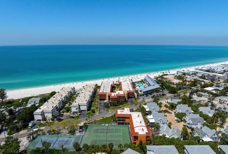 Enjoy coastal living at Playa Encantada on Anna Maria Island, where short-term rentals are permitted! This beautifully maintained second-floor condo features 2 bedrooms and 2 bathrooms and comes fully furnished, making it truly move-in ready. Located in one of the island’s most sought-after beachfront communities, residents enjoy a wide range of amenities including private beach access, a heated swimming pool, spa, tennis and pickleball courts, shuffleboard, elevator access, covered parking, and convenient beach entry just across the street. The unit offers desirable southern exposure with views overlooking the tennis courts. Inside, you’ll find a beautifully remodeled kitchen with elegant quartz countertops, stainless steel appliances, including a spacious double oven and an open-concept layout ideal for entertaining. The primary suite features a generous walk-in closet and a beautifully updated bathroom with a walk-in shower. Crown molding and tile flooring throughout add a refined touch. Additional highlights include an in-unit washer and dryer, a tankless water heater, stainless appliances installed in 2023 and an A/C system installed in 2021. Step out onto the large covered lanai to enjoy Florida’s lush scenery and stunning skies. A private owner’s storage room along with a dedicated parking spot is also included on the ground level. With a two-week minimum rental policy, this property offers excellent potential as an income-producing investment or a relaxing second home. Experience the best of the Florida lifestyle, including convenient private beach access with limited public entry nearby for added privacy. The condo is ideally located near a trolley stop, offering free and easy transportation to nearby restaurants and shops. Call for your private showing today.