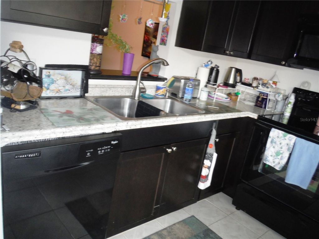 Photo of 1370 Heather Ridge Boulevard #104, Dunedin, FL 34698 (MLS # TB8435333)