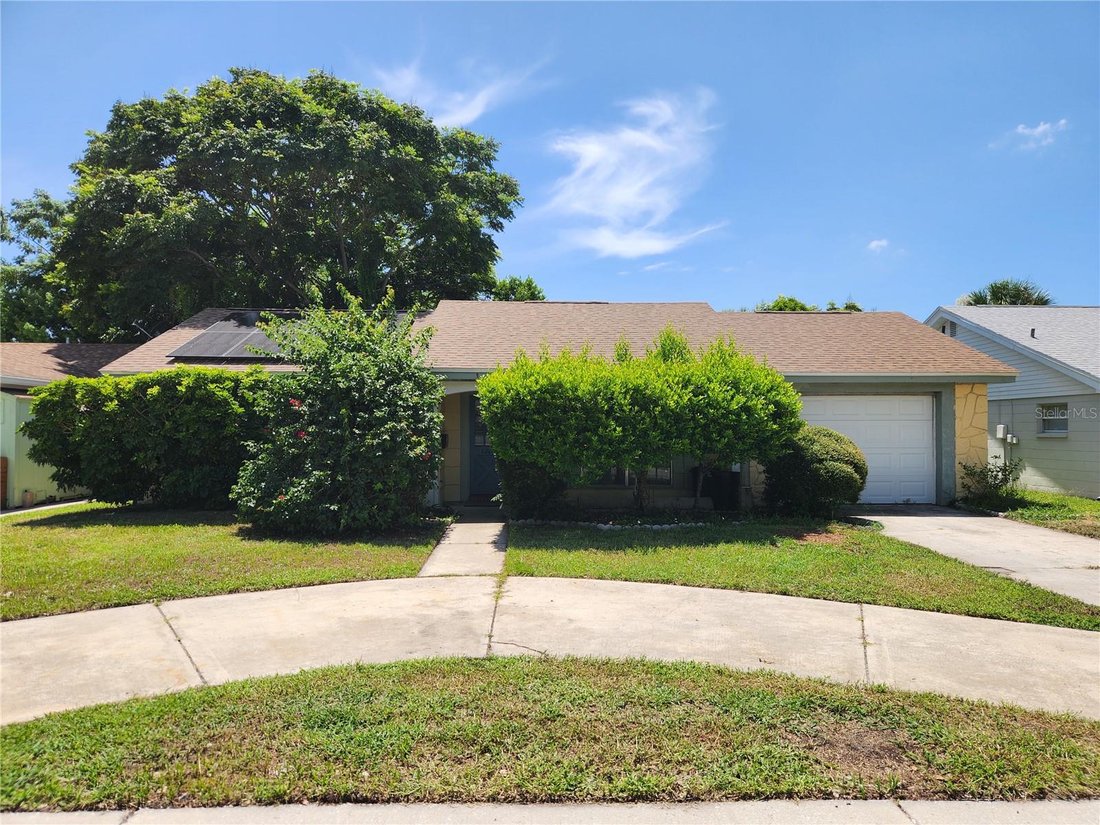 Available Now. Great opportunity for 3-bedroom 2 bath with fenced yard in Beacon Woods with Solar Electric Panels. Just north of SR 52 and US Hwy 19. Circle drive with 1 car garage. No carpet, only laminate flooring, and tile. Nicely maintained with large, fenced yard with Florida room. Main areas are a split plan with 2 large bedrooms and guest bath with step down into shower and separate primary suite with smaller primary bath. Main living room area has laminate flooring and kitchen with dining/breakfast area has tile floors. All appliances, solar electric and lawn service included. All other utilities and services are Tenant responsibility. Electric connection required, only Solar Panel use is included which is a monthly savings. Renters Insurance required. Maximum 2 pets under 35 lbs. with additional monthly pet fee. Breed restricted. The laundry is in the garage - no opener. 1st and security of $2600 with pet fee required.