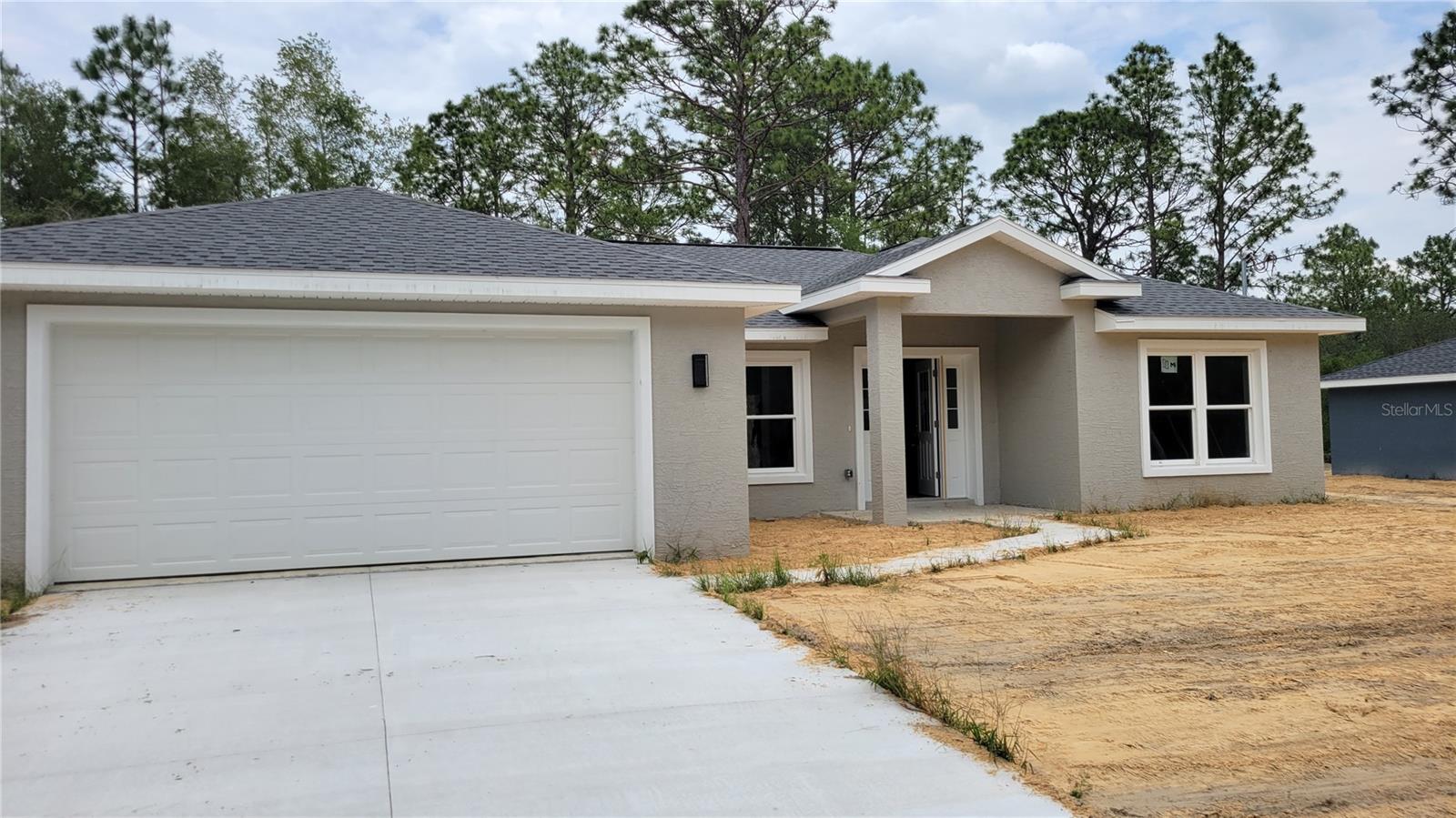 BRAND NEW CONSTRUCTION. ** READY TO MOVE IN END OF JUNE 2023 **. With the Withlacoochee State Trail on your doorstep this brand new home is the your perfect choice for a quiet country living but close access to major metropolitan areas. This 3 Bedroom, 2 Bath features cement block construction, a 30-year architectural roof, modern kitchen and bathrooms with high-end fixtures, vaulted ceiling in the living room, custom white shaker cabinets with soft close drawers, stainless steel appliances, luxury vinyl planking throughout the entire home, shower enclosure in the main bathroom, granite countertops in kitchen and bathrooms, and double-pane windows throughout. Located just 40 minutes from Ocala, 40 min to Fort Island beach, 1 hour to Gainesville, 1.5 hours to Orlando, and 1.5 hours to Tampa.*** USDA ELIGIBLE ***