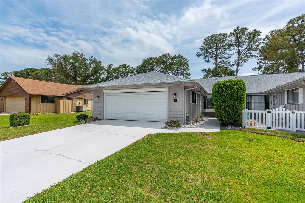 Photo of 35 Lake Fairgreen Circle, New Smyrna Beach, FL 32168 (MLS # FC318235)