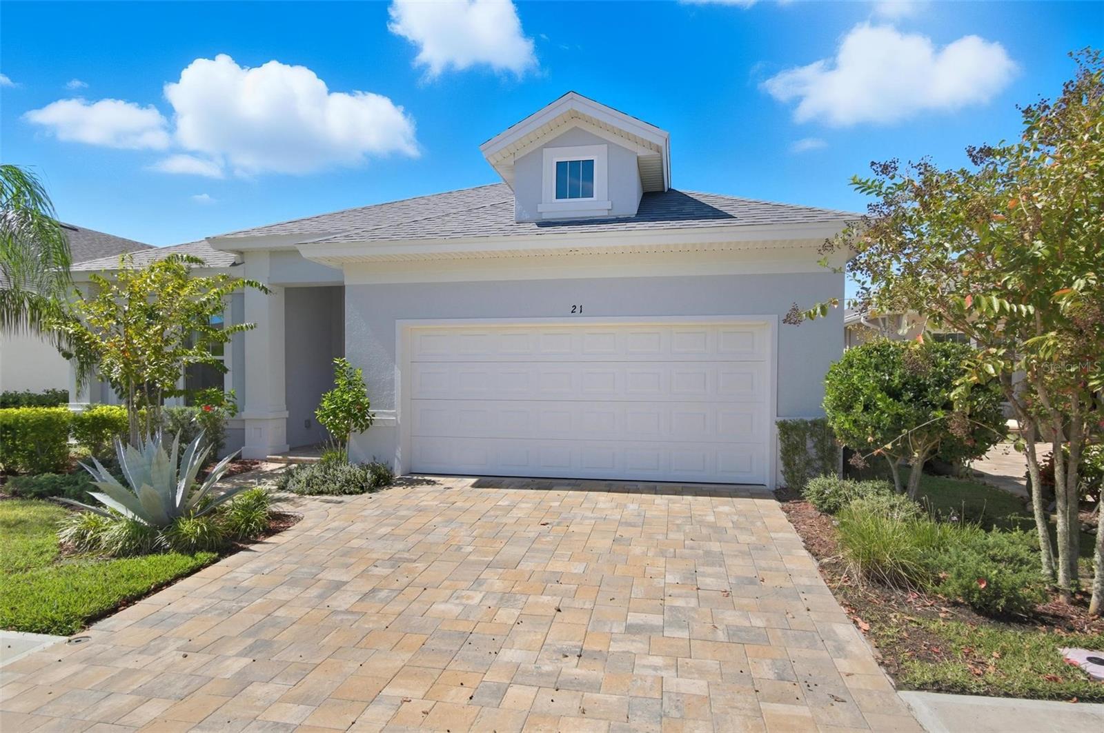 Paytas built home home with just over 2100 living square feet blends modern luxury with smart design and serene surroundings thanks to a water and conservation view. With its spacious layout, home office, covered lanai, and premium finishes such as 42 inch cabinets, Quartz counters in the kitchen, premium tile in all areas except bedrooms and an upgraded light package this rental offers a comfortable and stylish lifestyle in Palm Coast's town-center community of Coastal Gardens. Just 10 minutes to the beach and conveniently located to shopping, medical and restaurants.