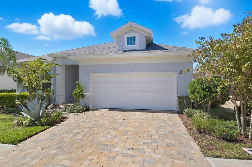 Paytas built home home with just over 2100 living square feet blends modern luxury with smart design and serene surroundings thanks to a water and conservation view. With its spacious layout, home office, covered lanai, and premium finishes such as 42 inch cabinets, Quartz counters in the kitchen, premium tile in all areas except bedrooms and an upgraded light package this rental offers a comfortable and stylish lifestyle in Palm Coast's town-center community of Coastal Gardens. Just 10 minutes to the beach and conveniently located to shopping, medical and restaurants.